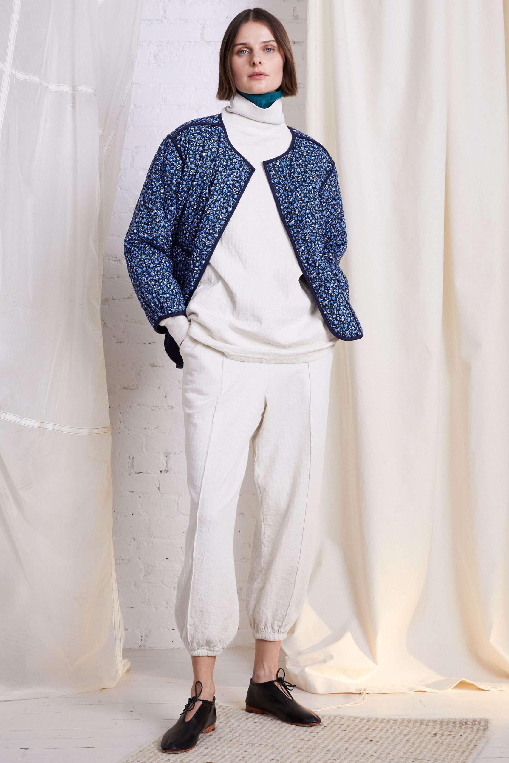 blue printed jacket with white sweater