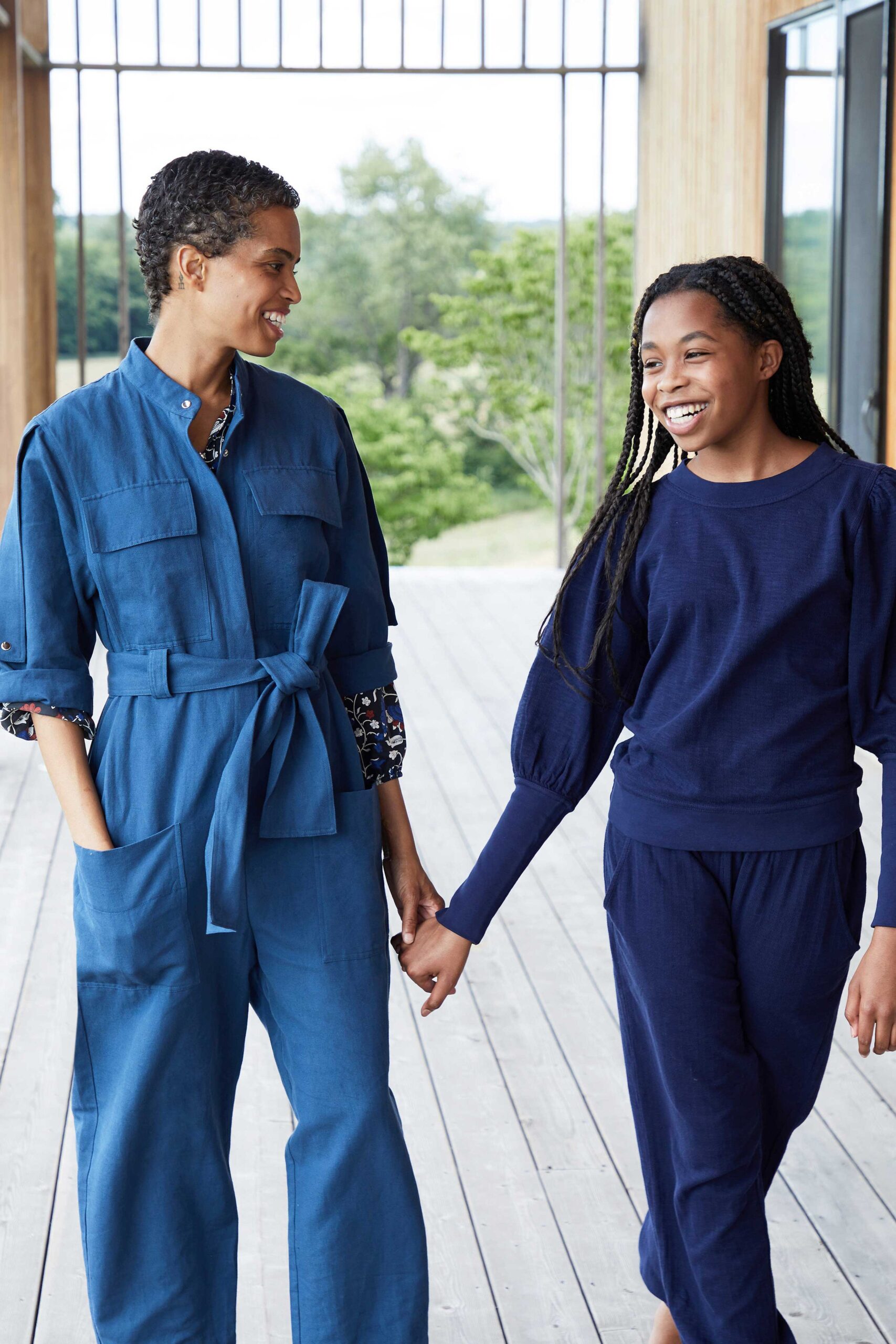 blue cotton jumpsuit and navy sweater