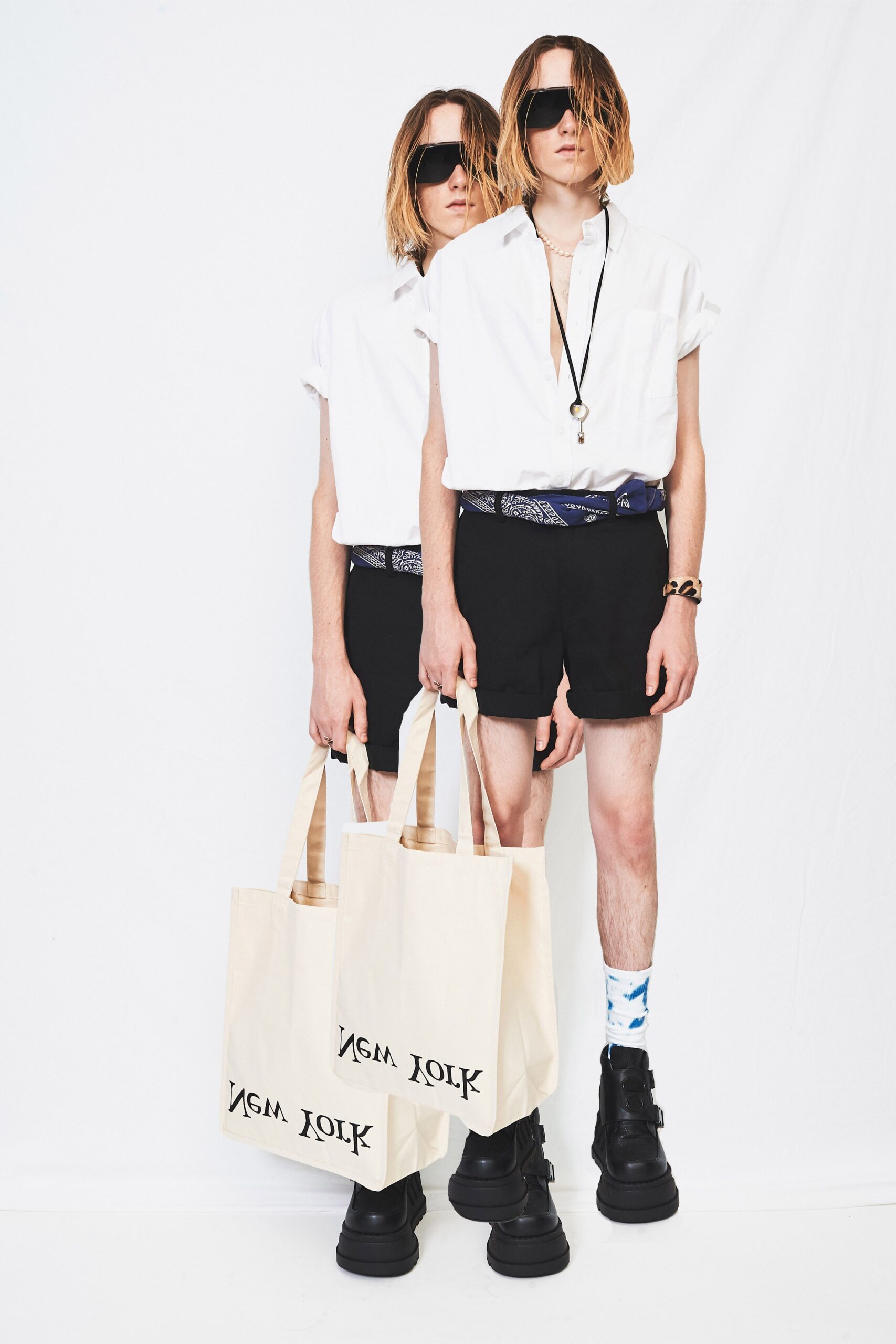 white relaxed shirt and black shorts