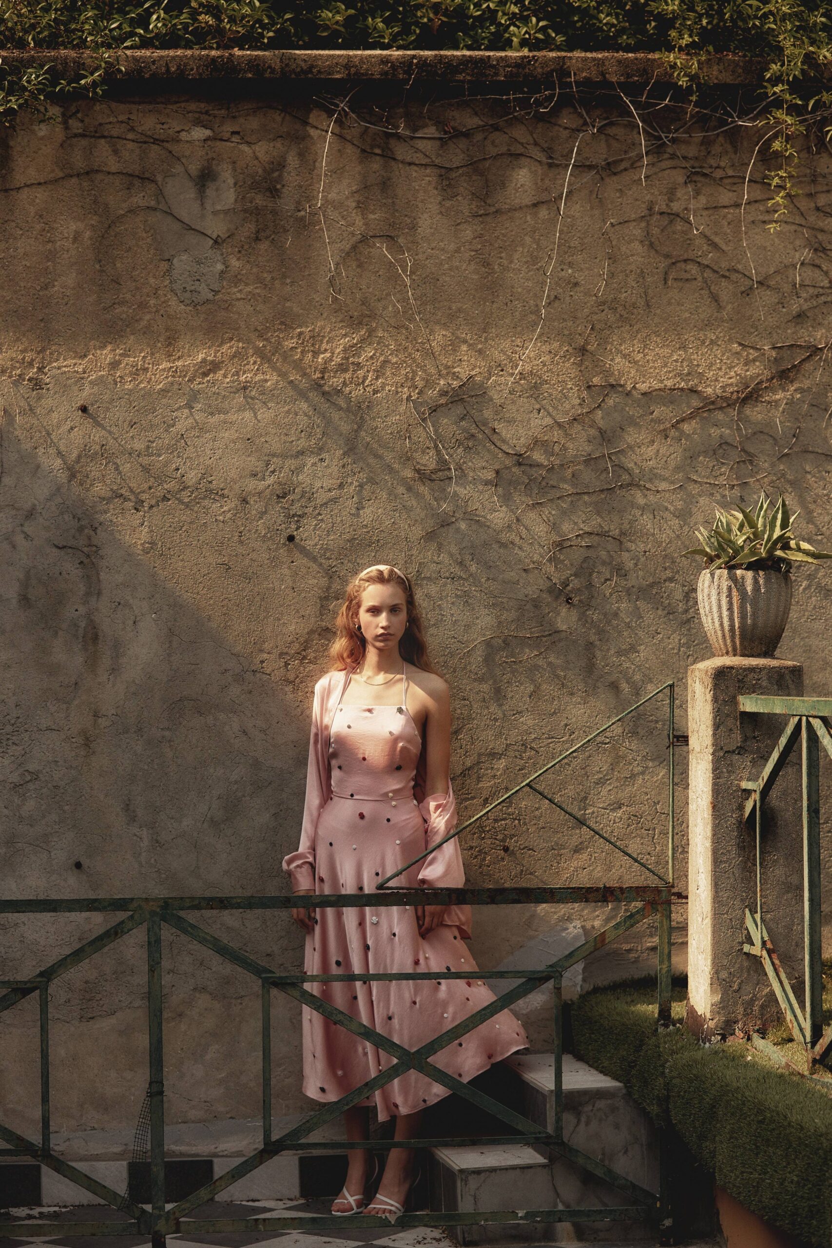 pink silk sleeveless v-neck fitted a-line draped dress
