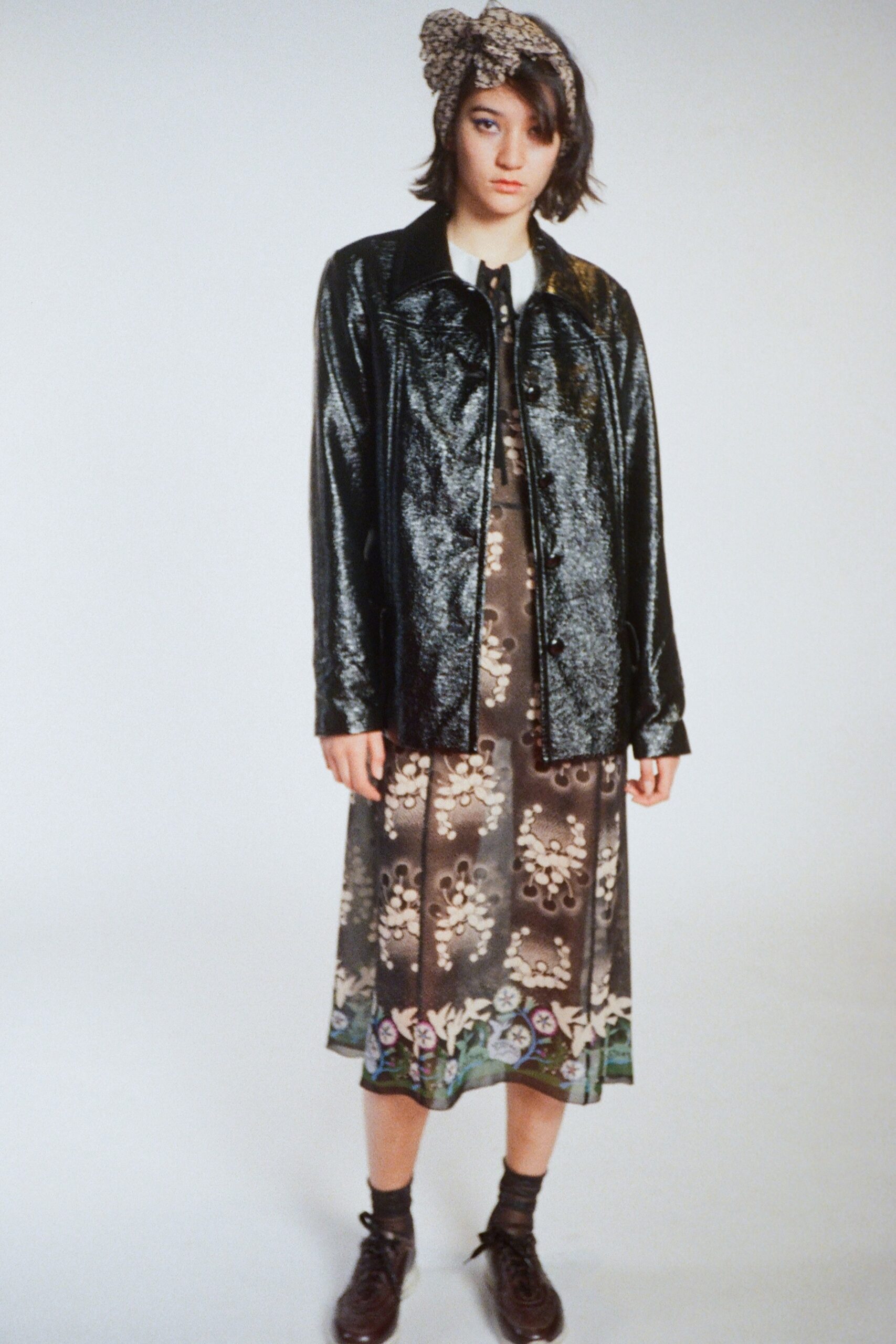 black vinyl jacket and floral dress