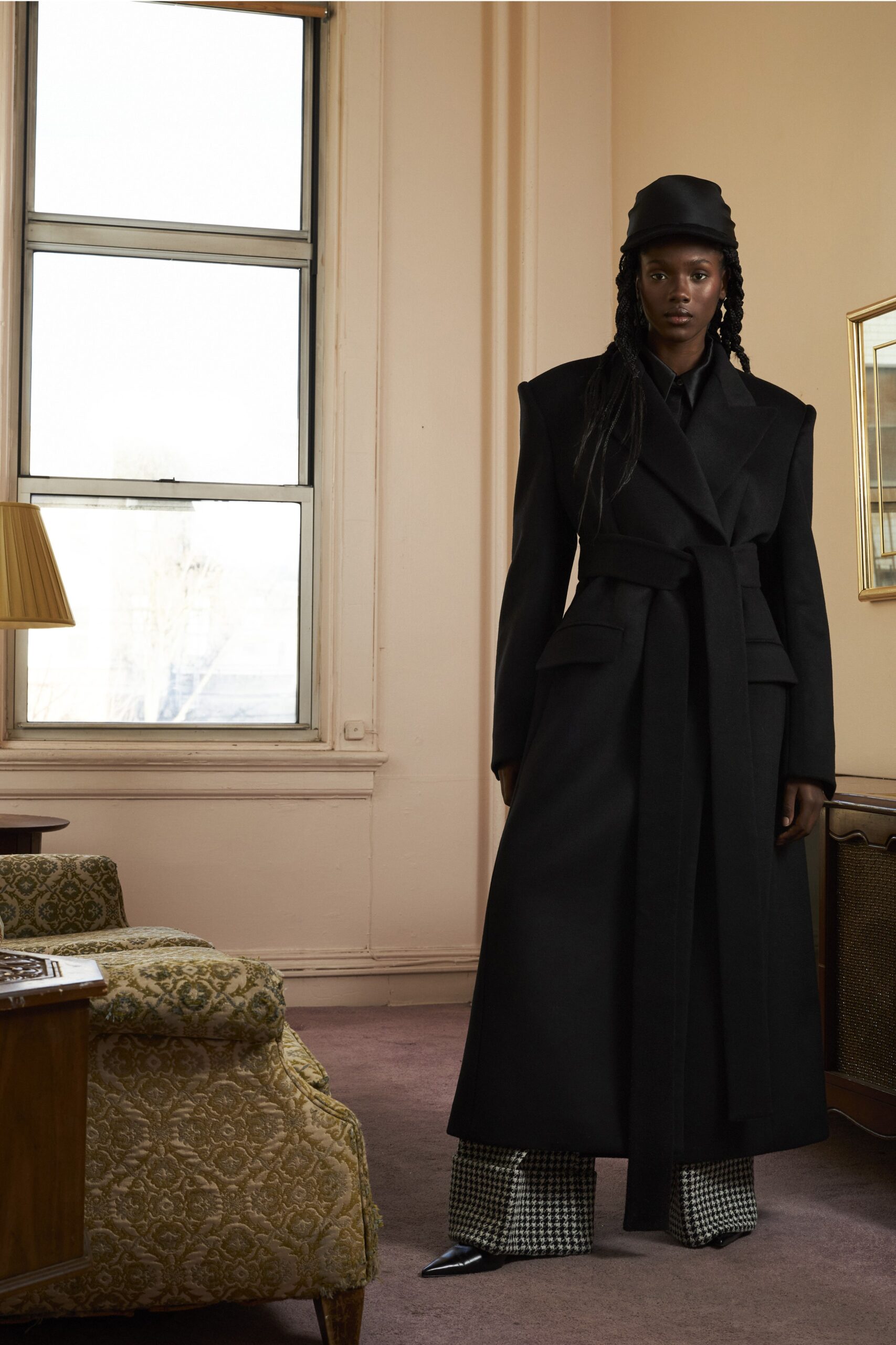 black tailored coat with checked pants