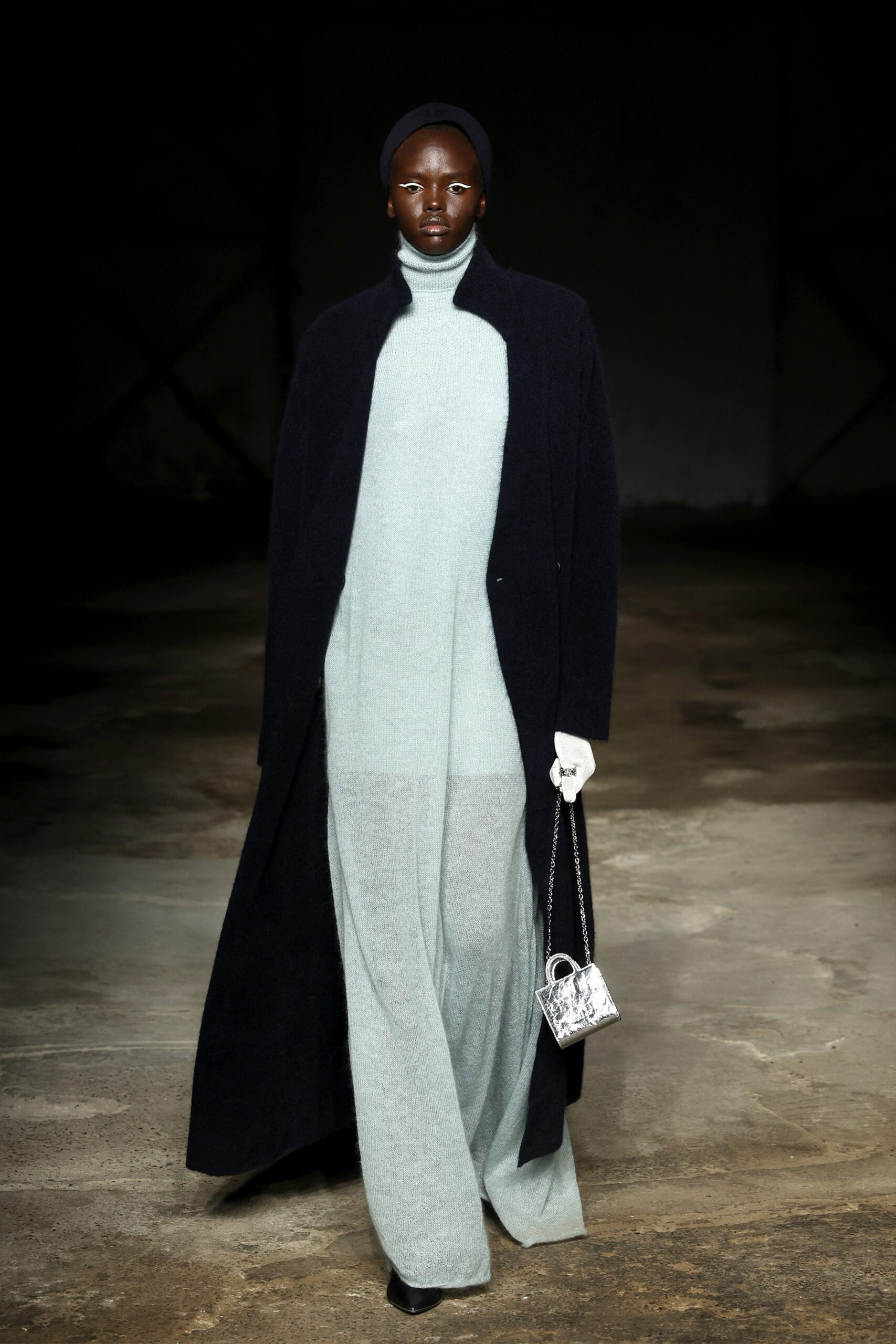 black wool coat and mint knit dress