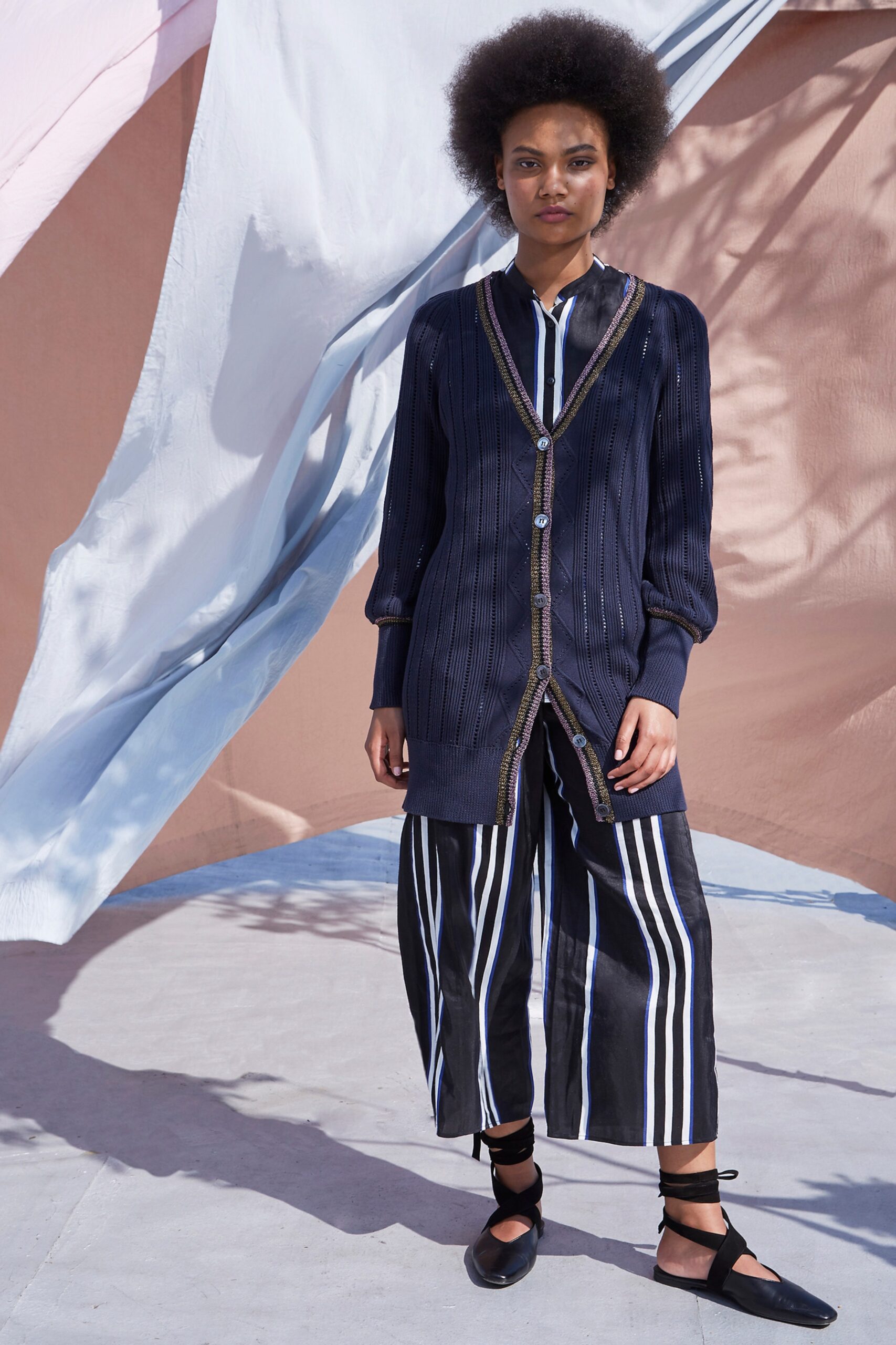 blue and white striped shirt with black striped pants