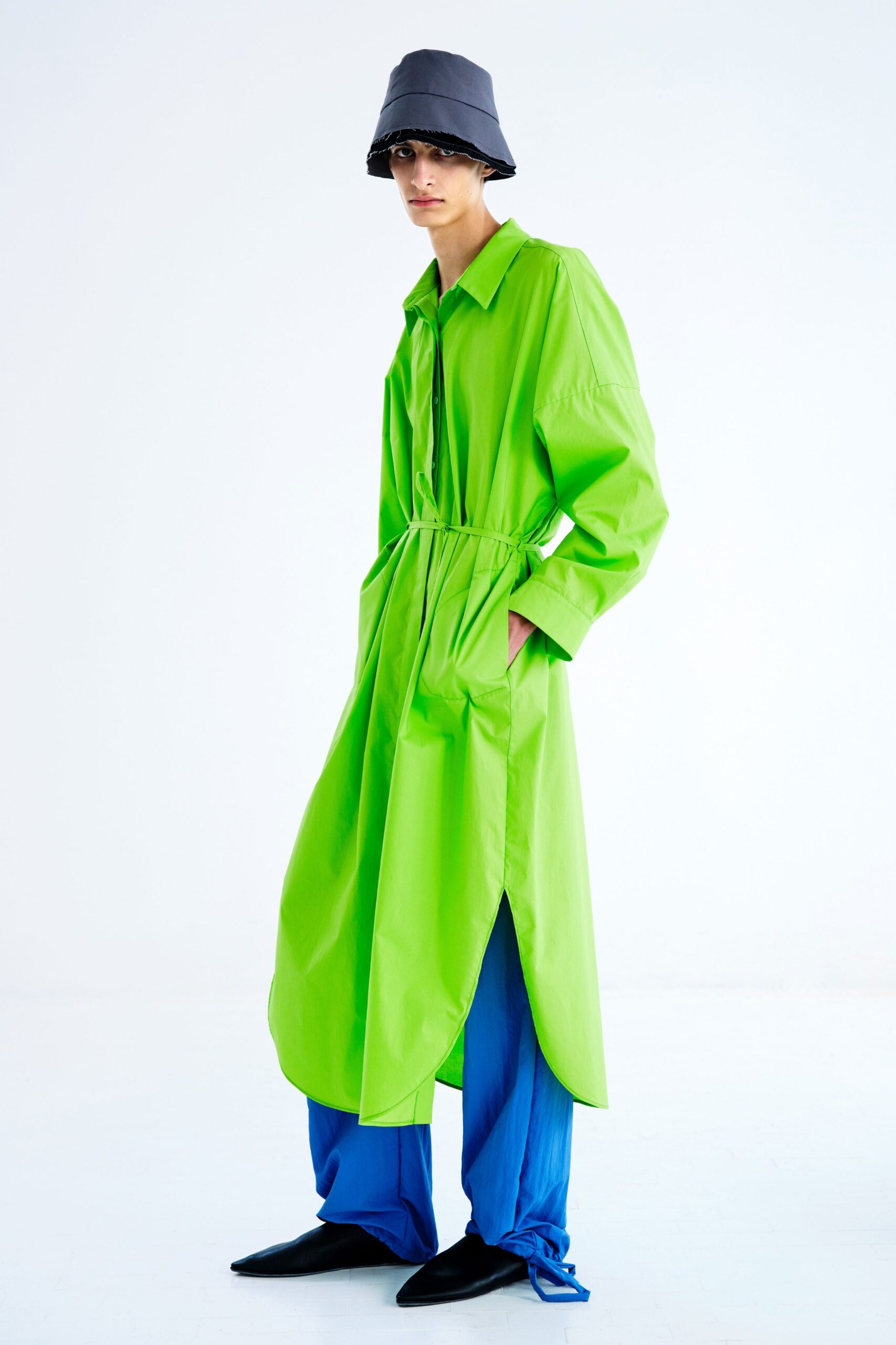 green coat with blue pants