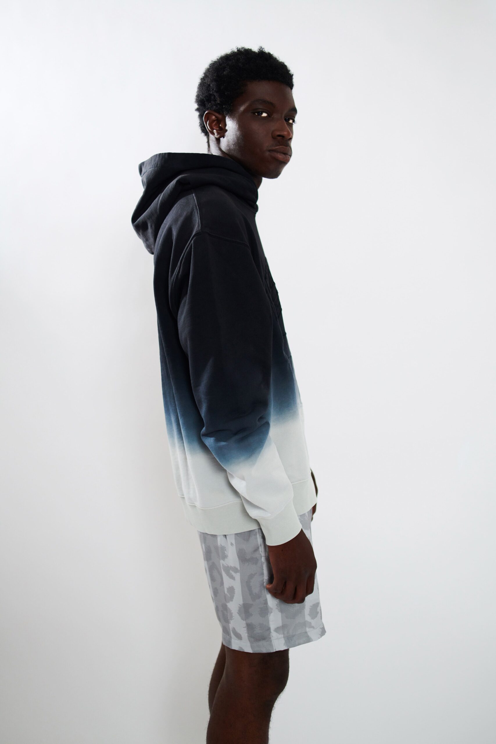 black and white color-blocked hoodie with gray shorts