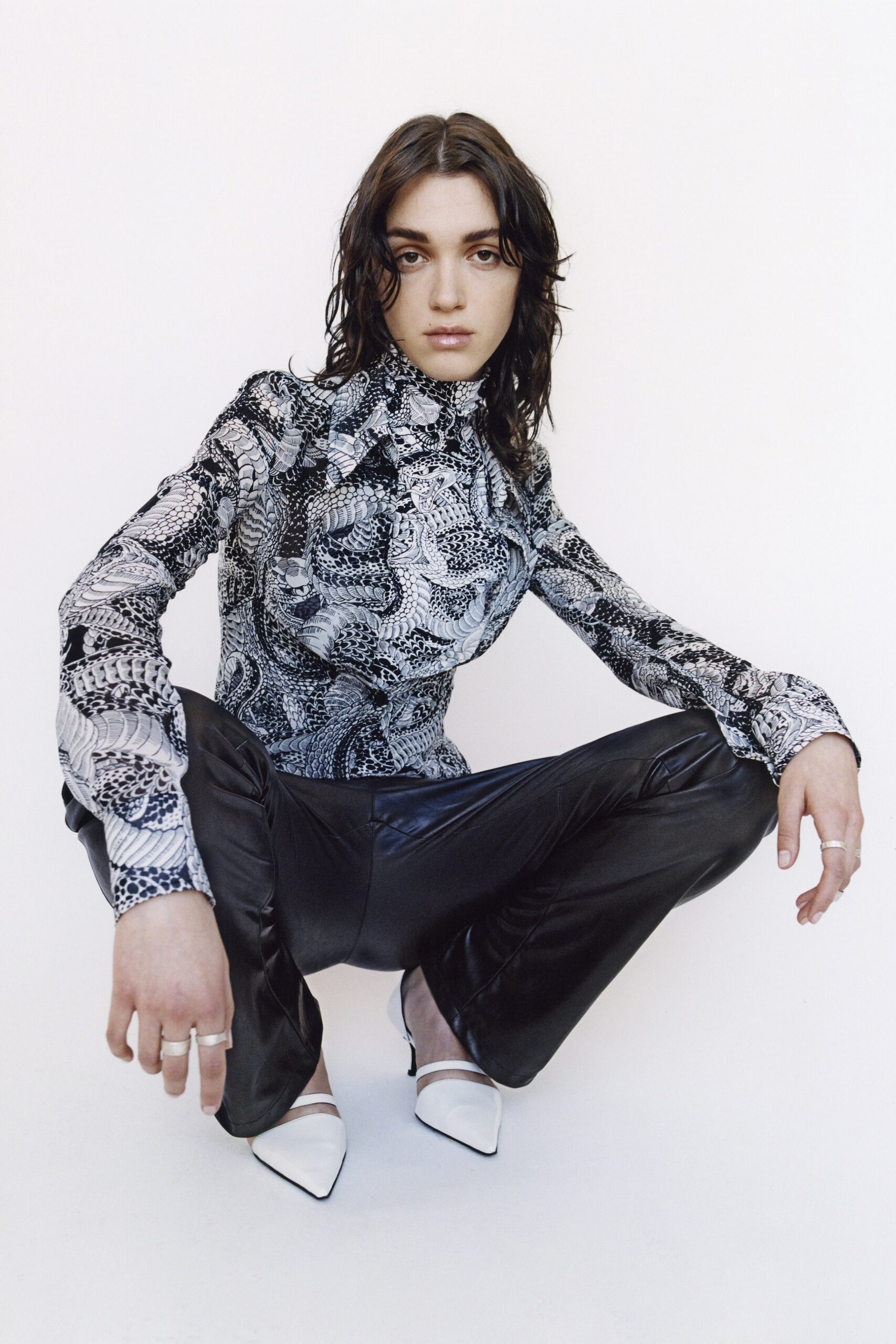 fitted black and white top with leather pants