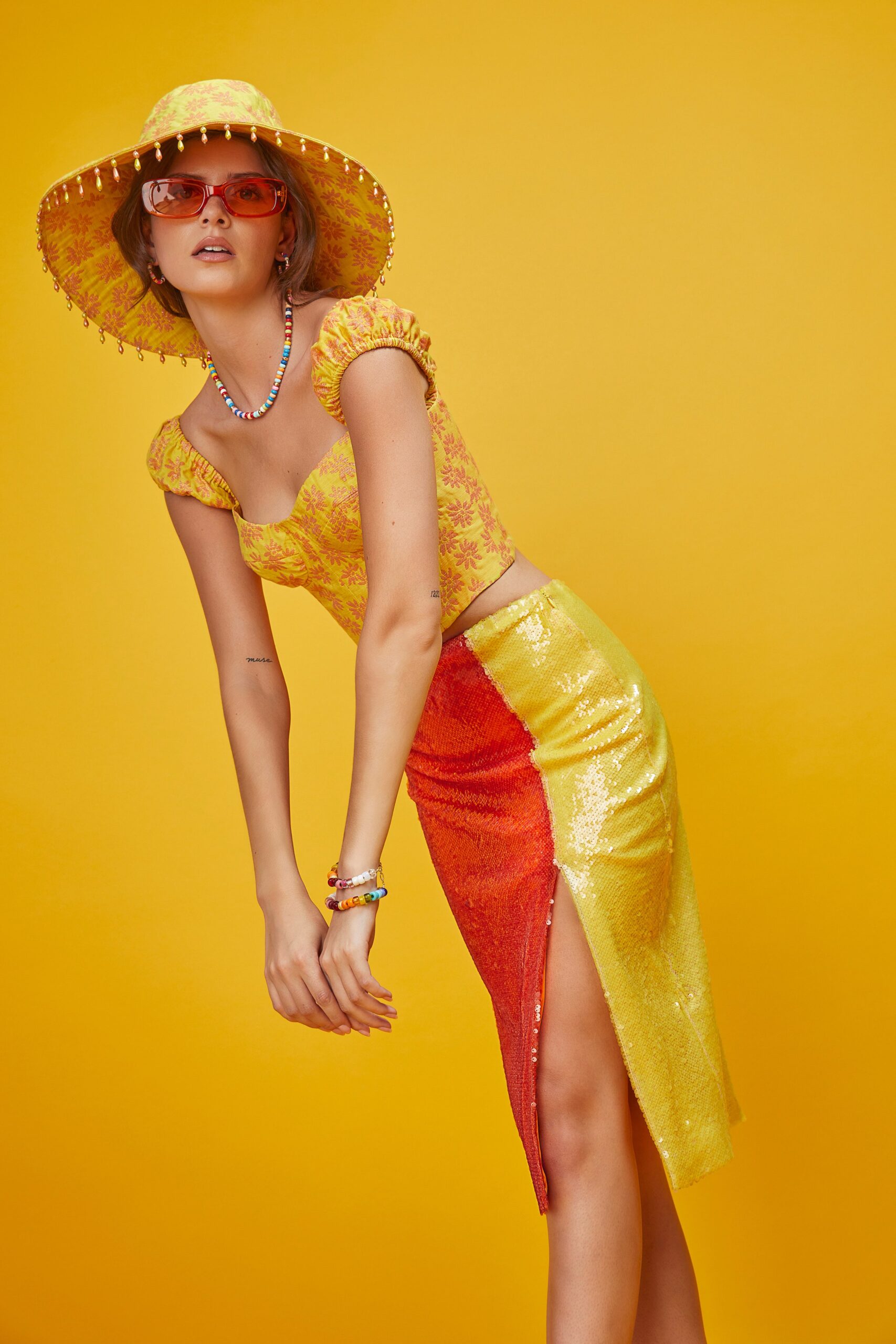 yellow floral top with sequin skirt