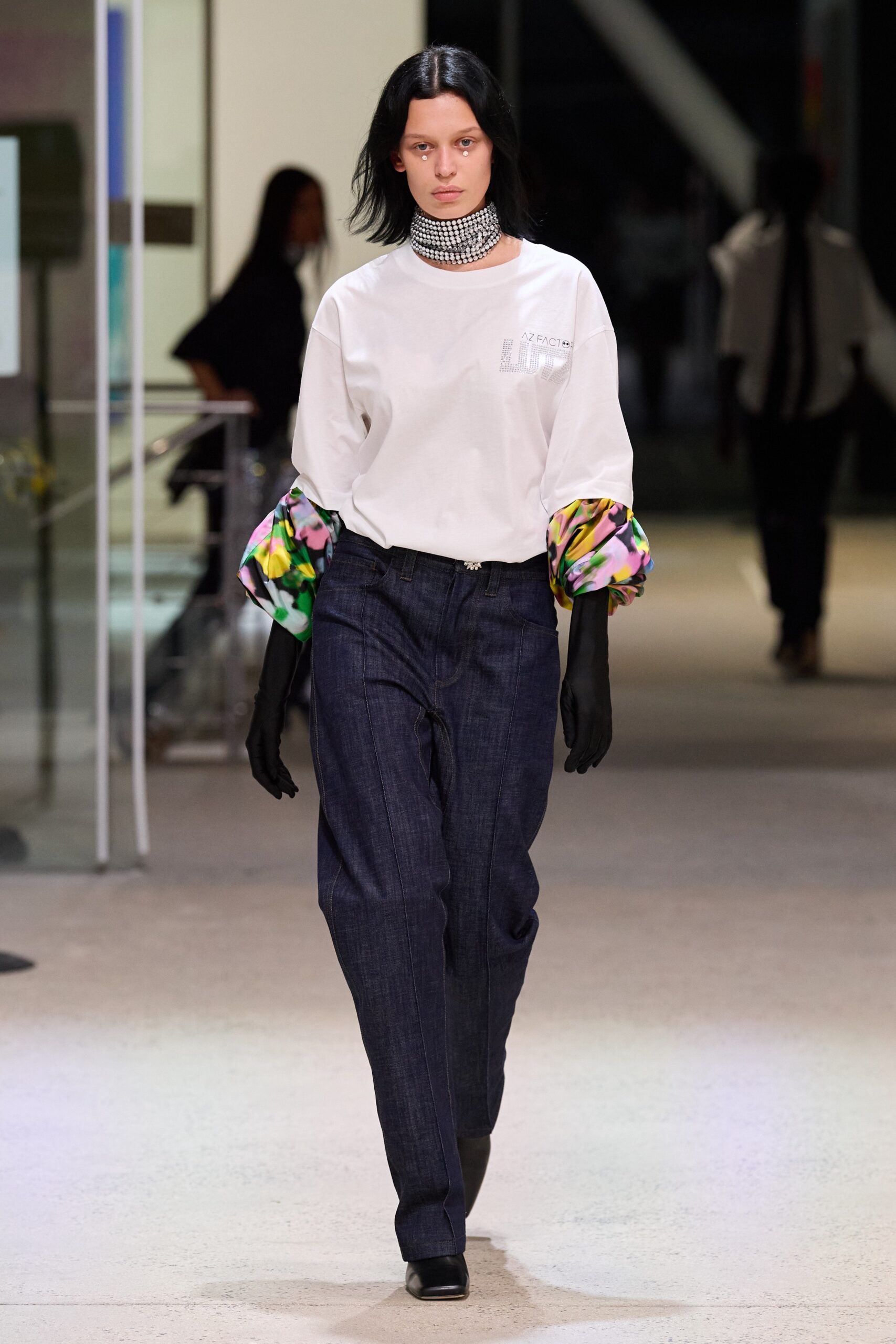 white relaxed top with blue pants