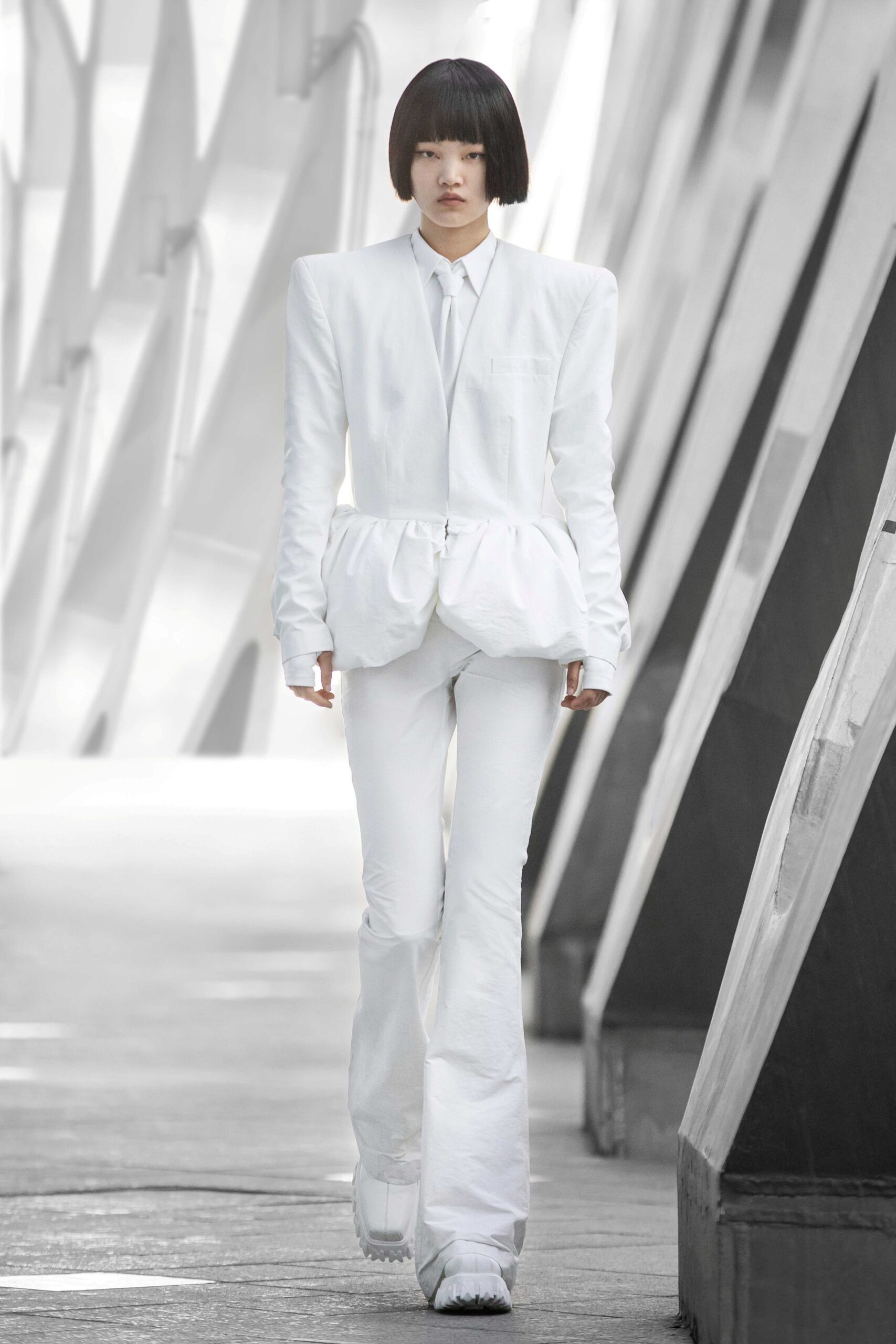 white fitted suit with flared pants