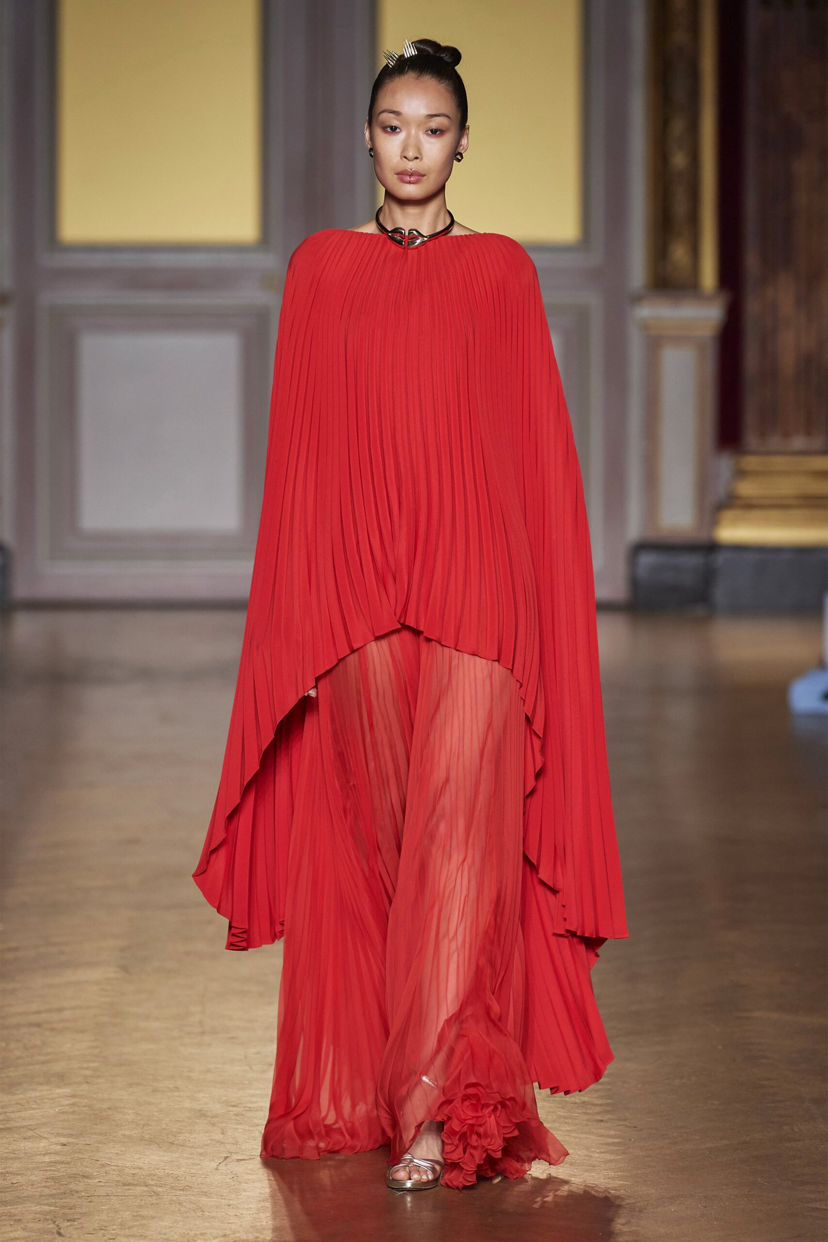 red pleated cape and dress