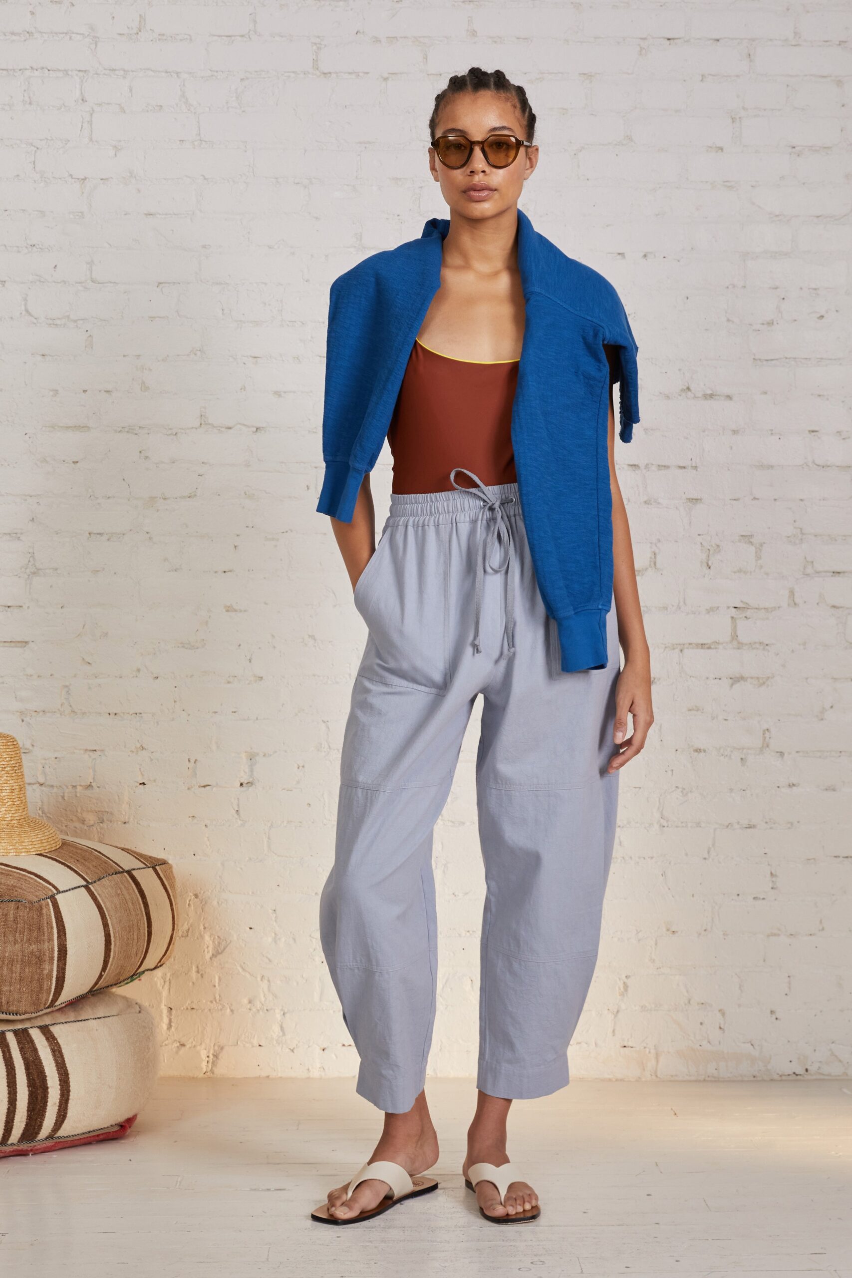 brown bodysuit with relaxed gray pants