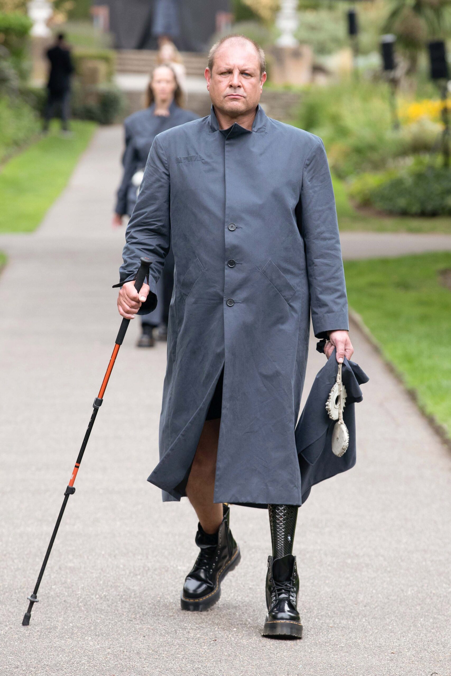 gray relaxed coat and black boots