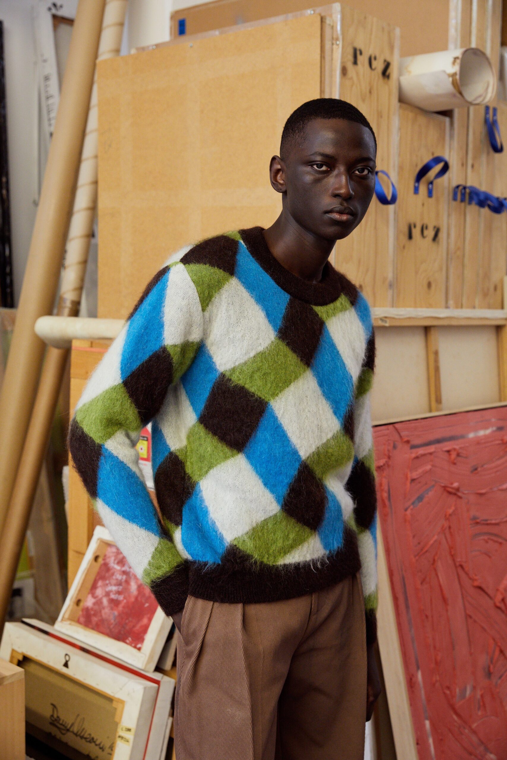 blue green brown patterned sweater with tailored pants