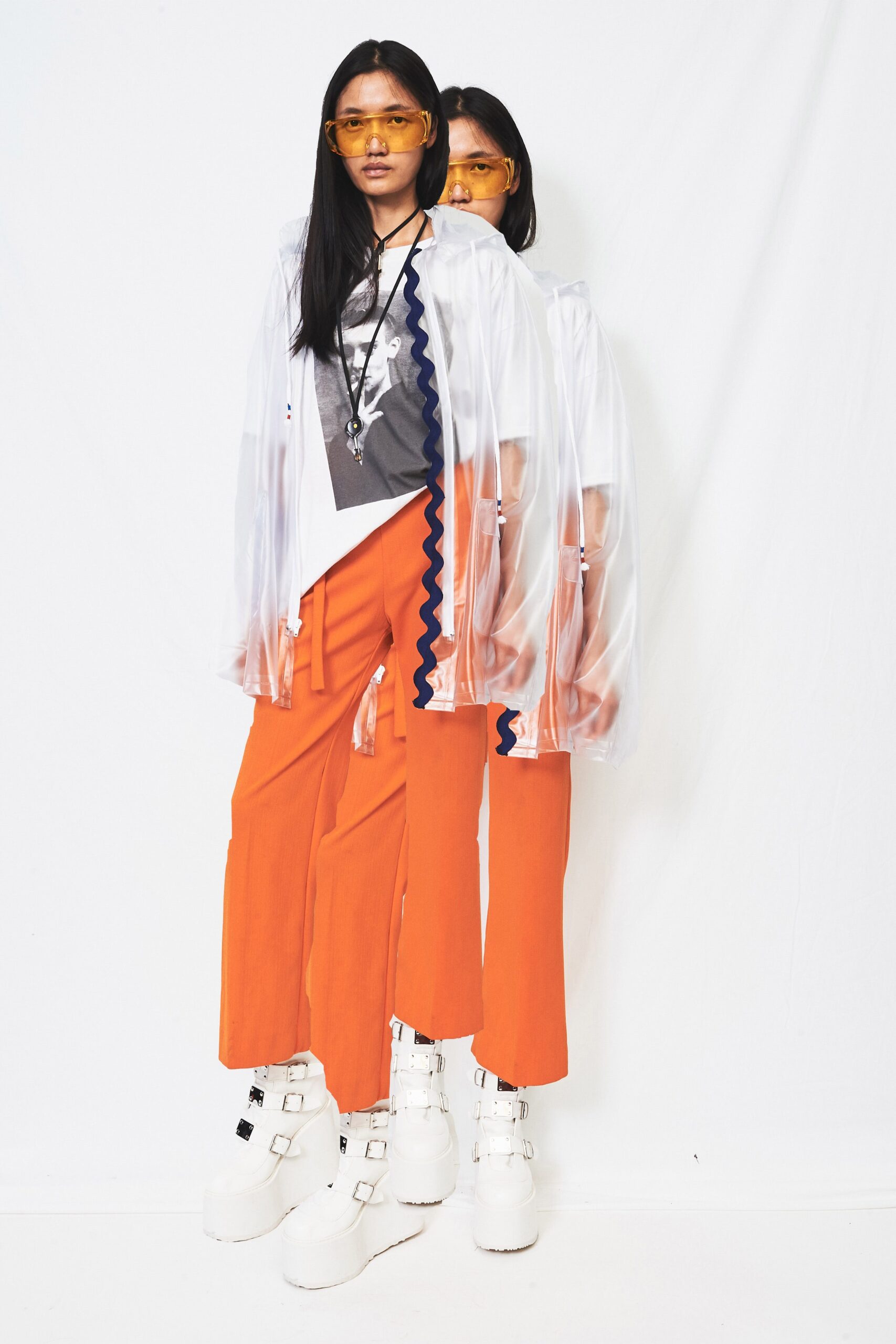 white relaxed top with orange pants