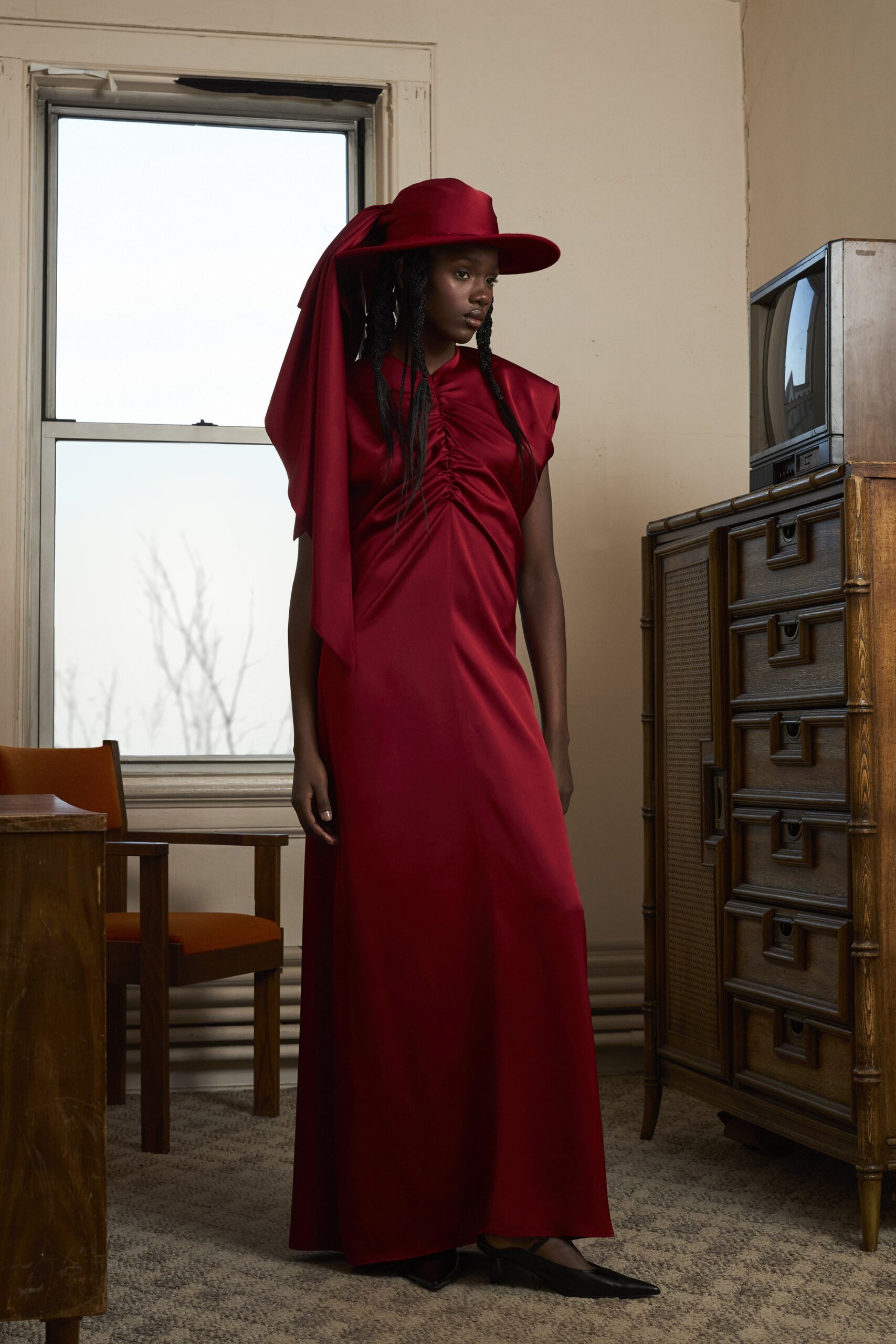 red silk fitted gown with hat