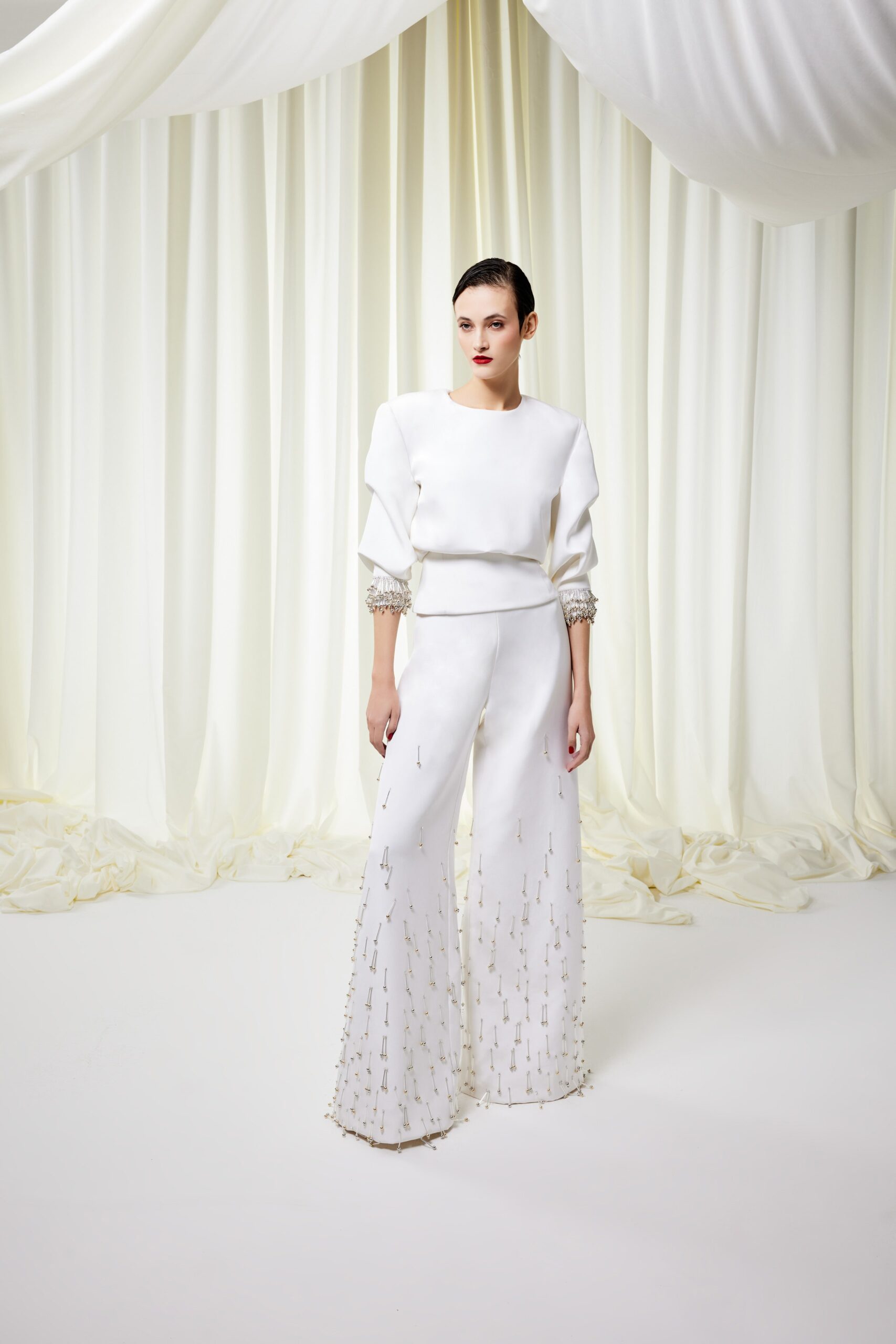 white fitted top and flared pants