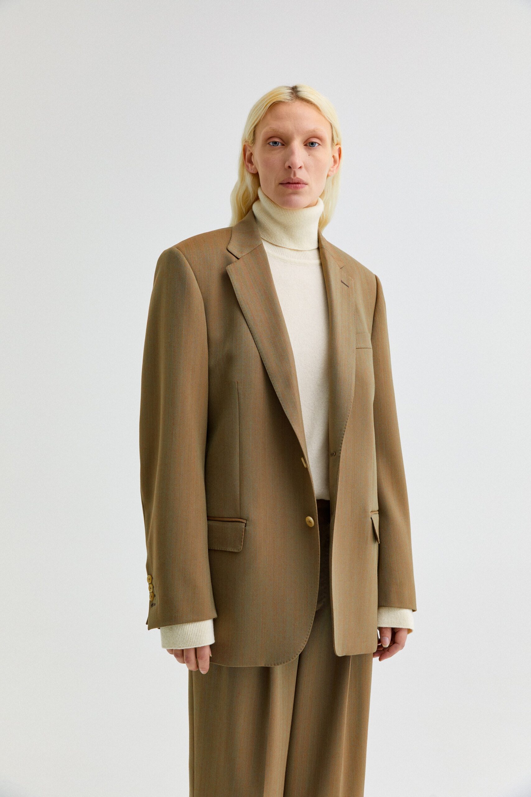 brown relaxed blazer with ivory turtleneck