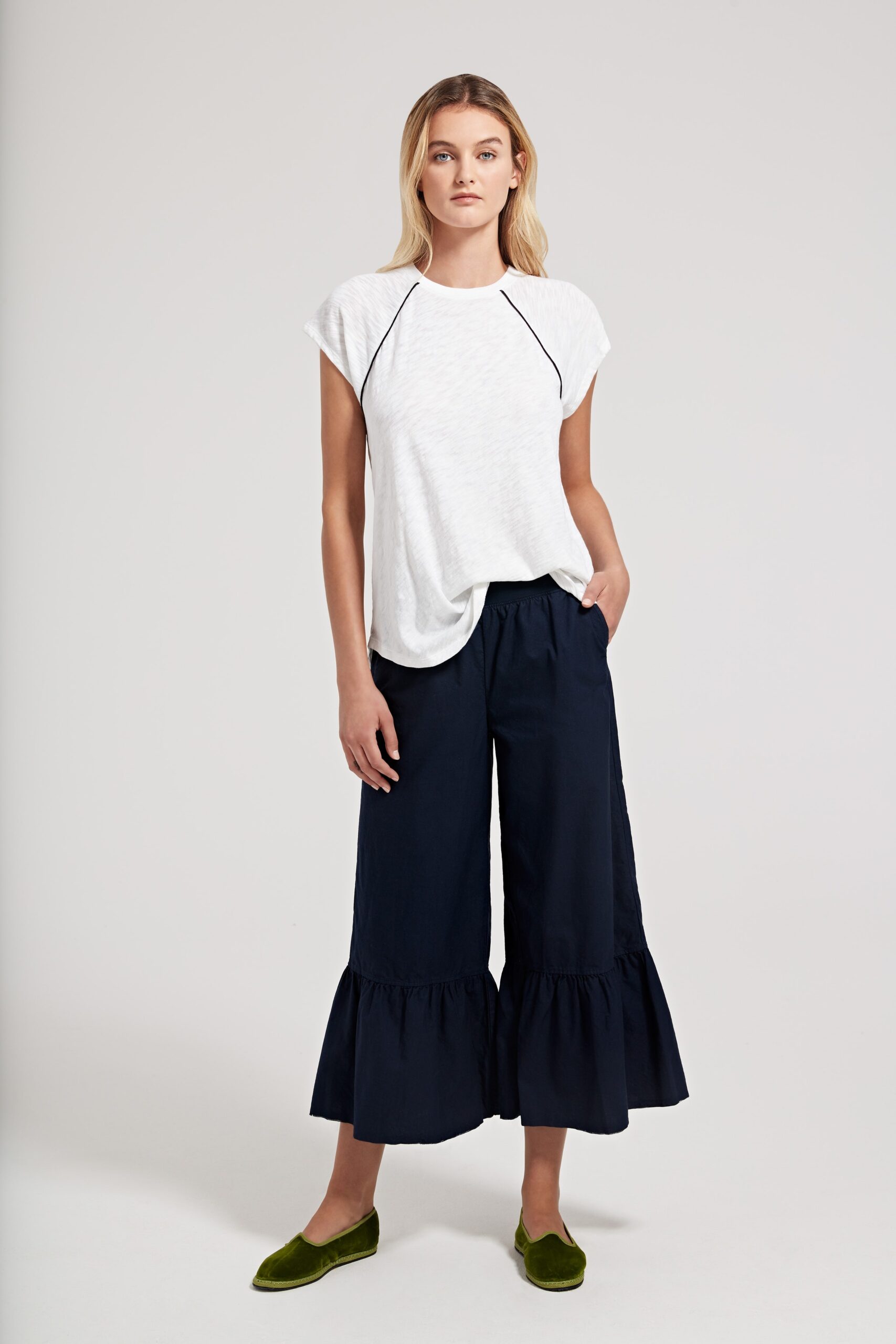 white relaxed top with navy flared pants