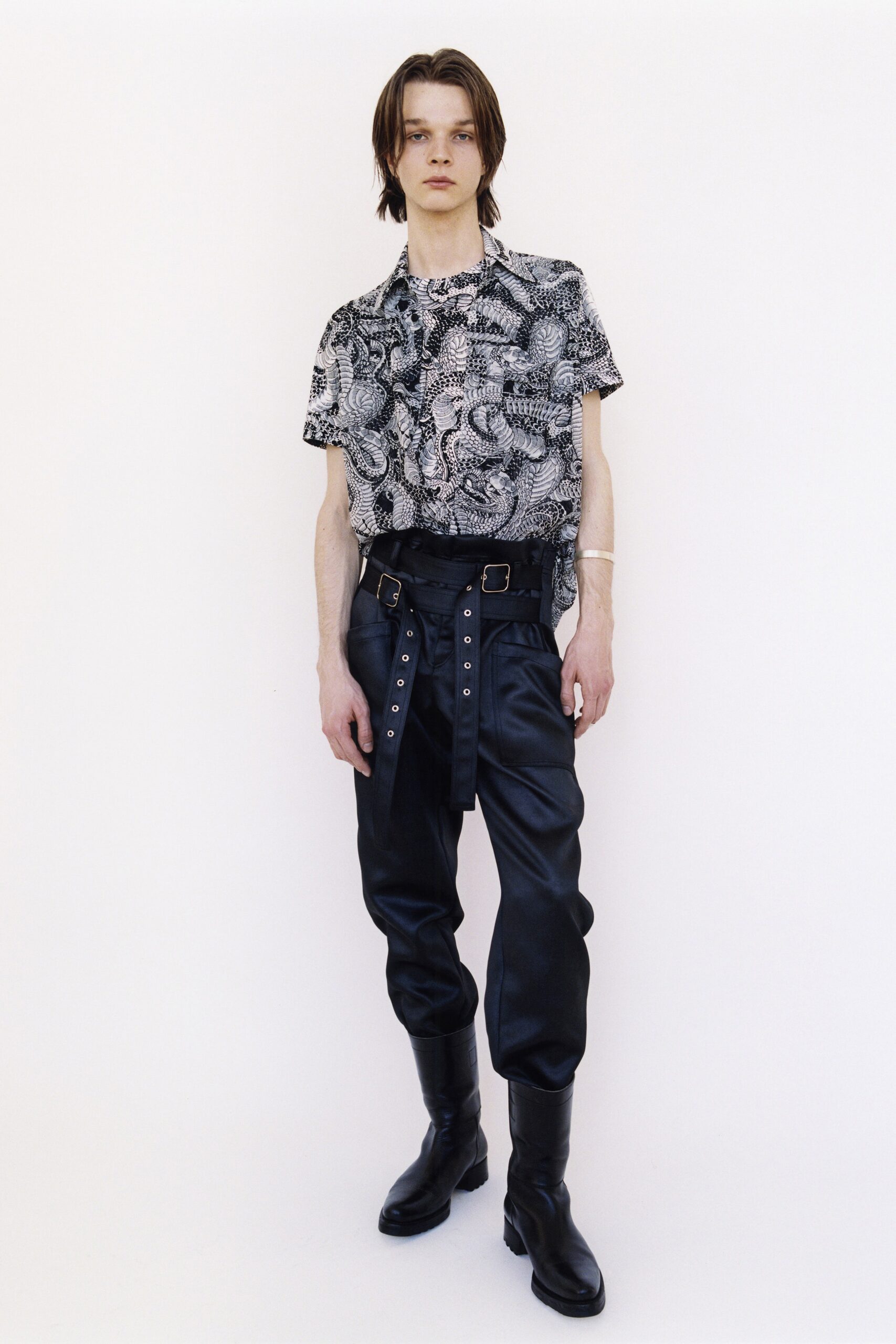black and white printed shirt with leather pants