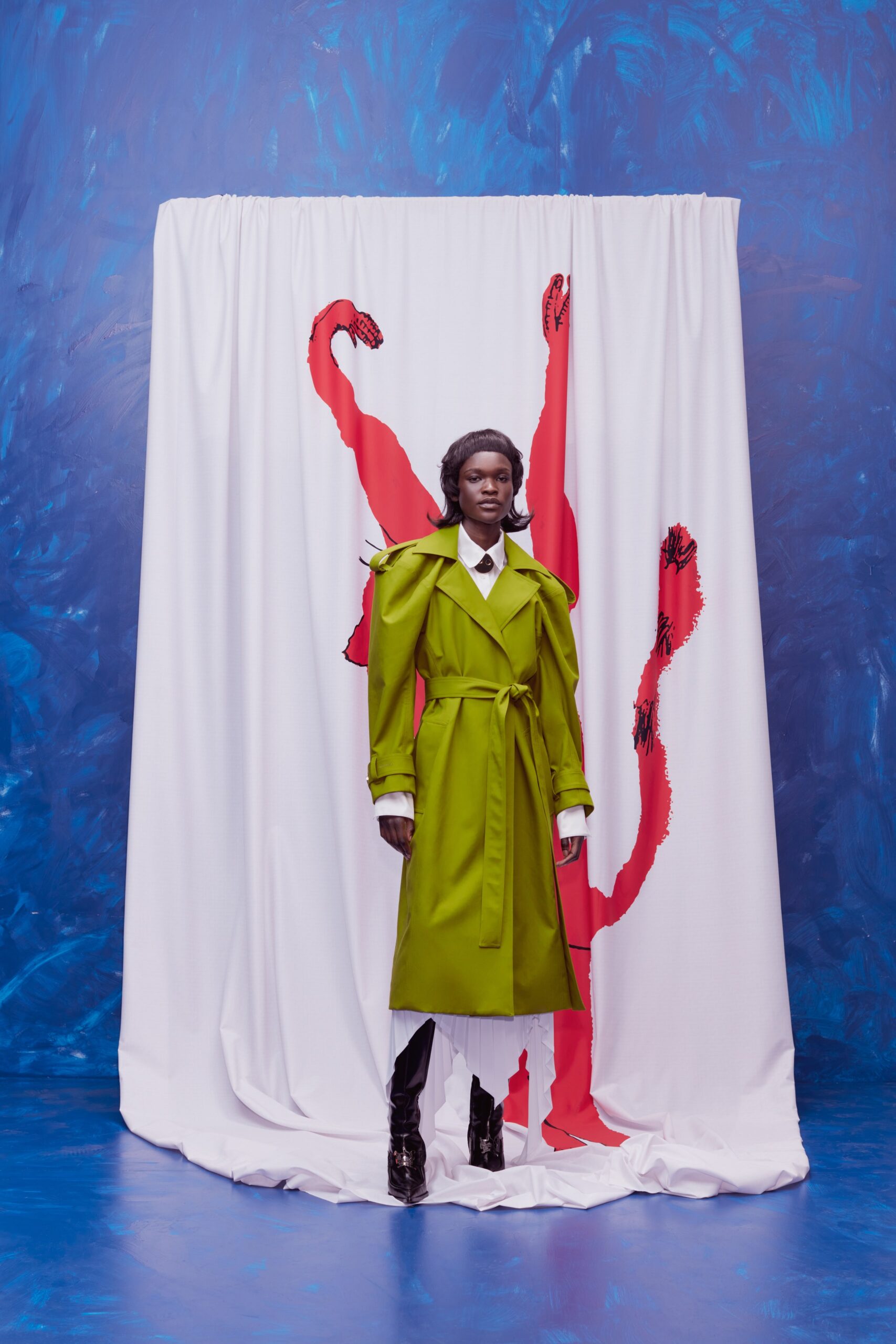 green trench coat with black pants