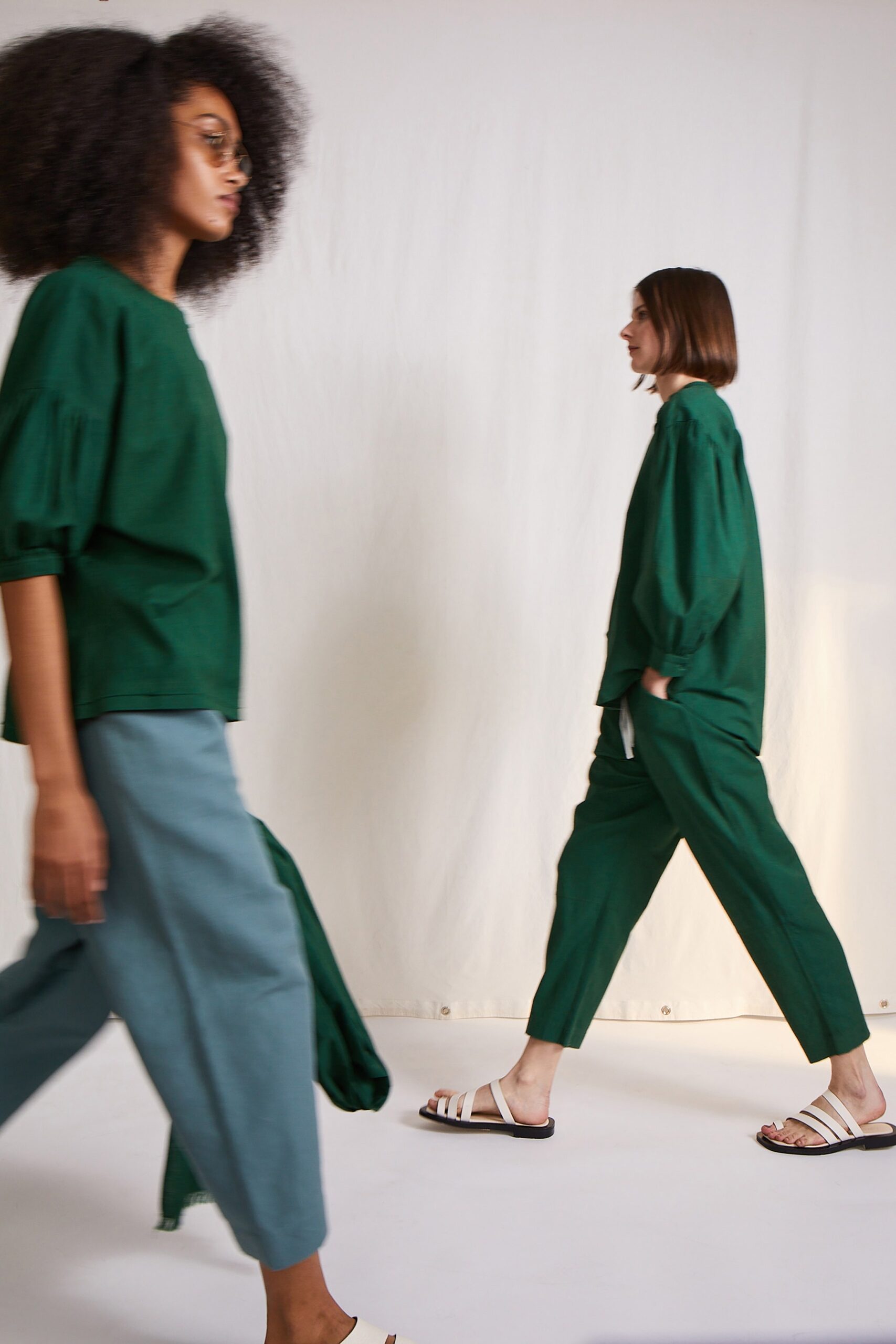 green relaxed top and blue pants
