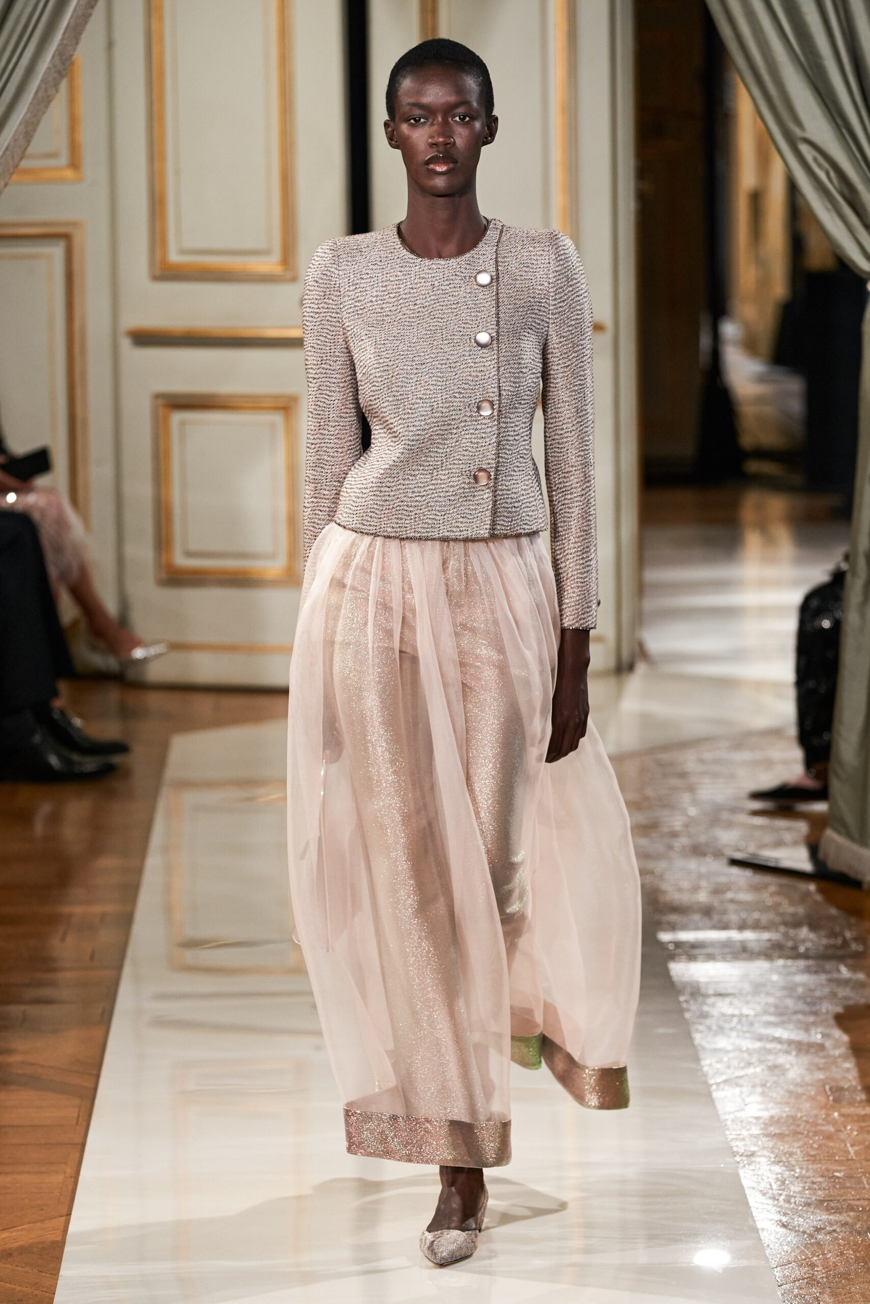 beige tweed fitted jacket and pink chiffon skirt