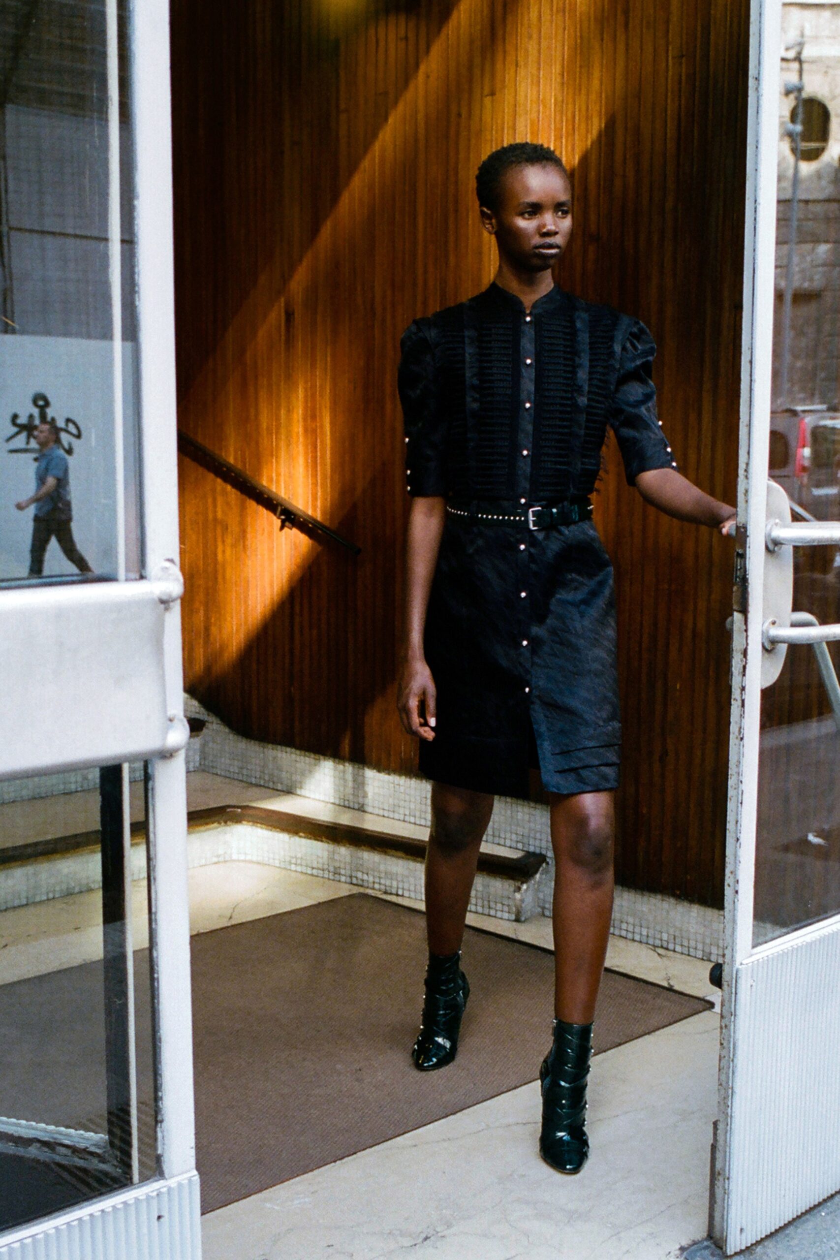 black fitted mini dress with green shoes