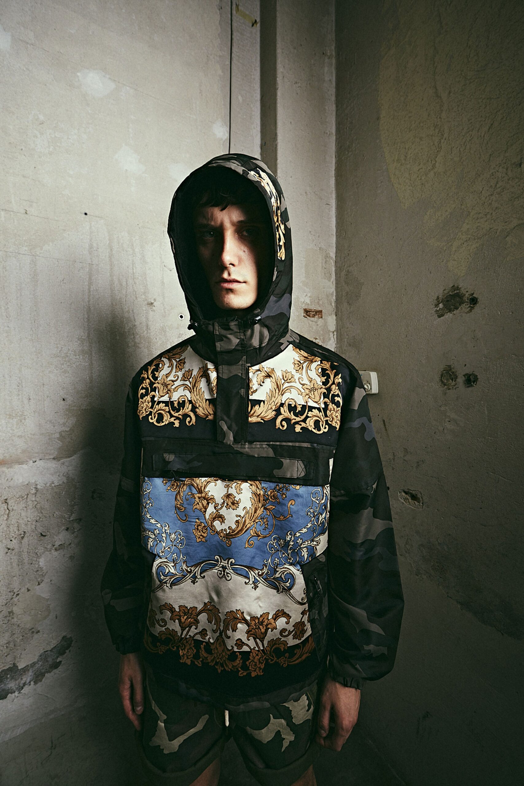 black printed hooded jacket with camouflage shorts