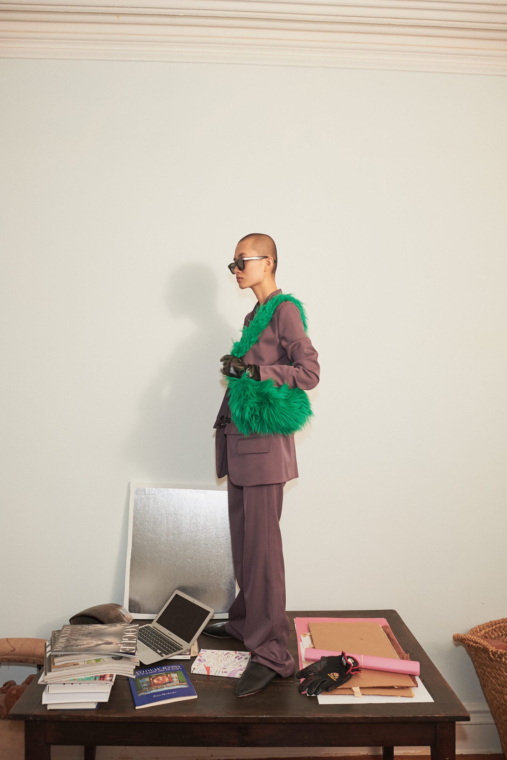 purple tailored suit with green bag