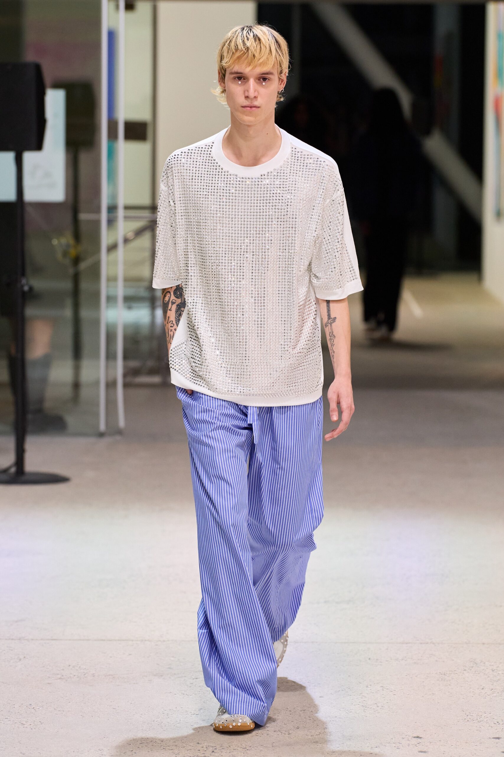 white relaxed top with blue striped pants