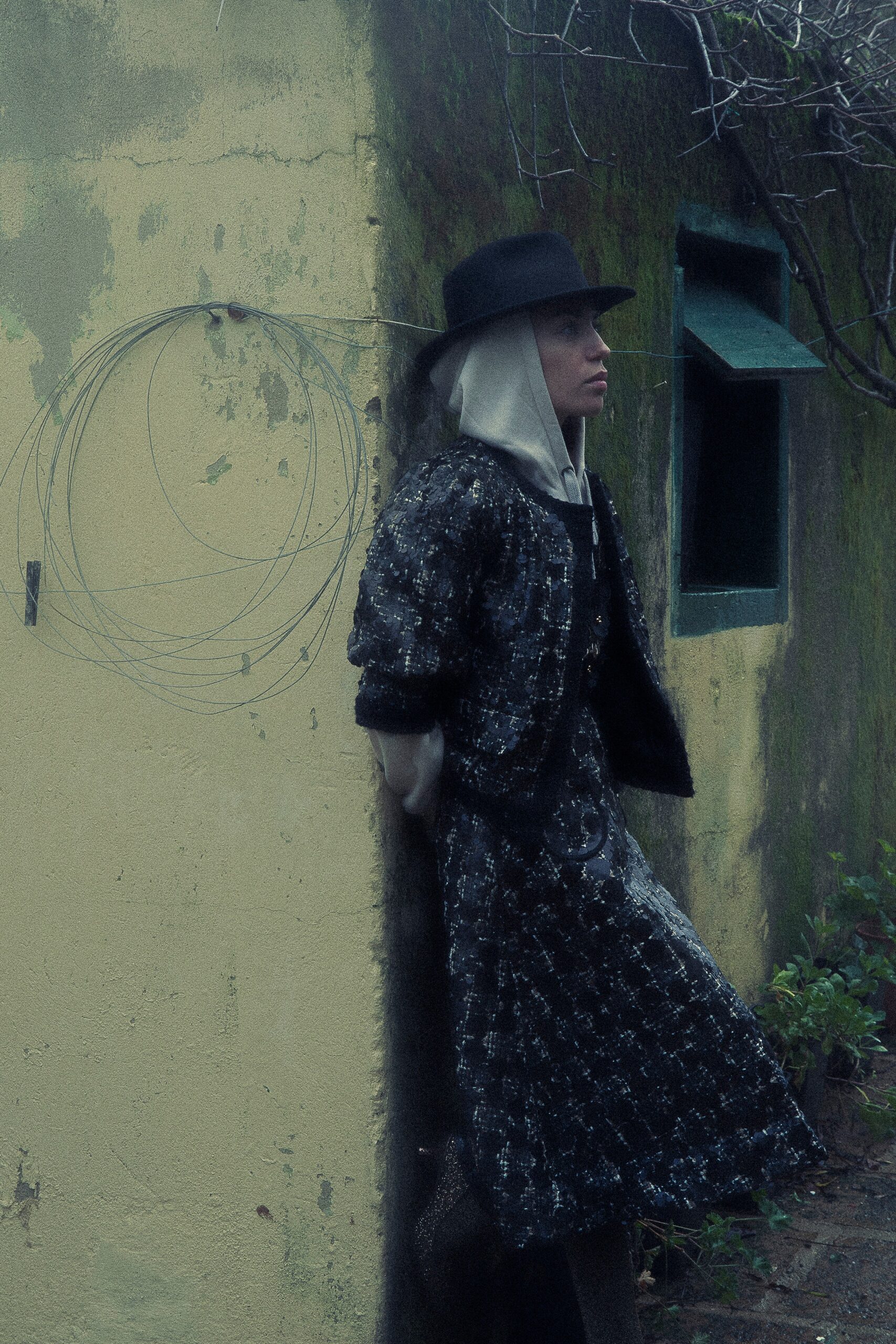 black wool long-sleeve collared fitted layered buttoned coat