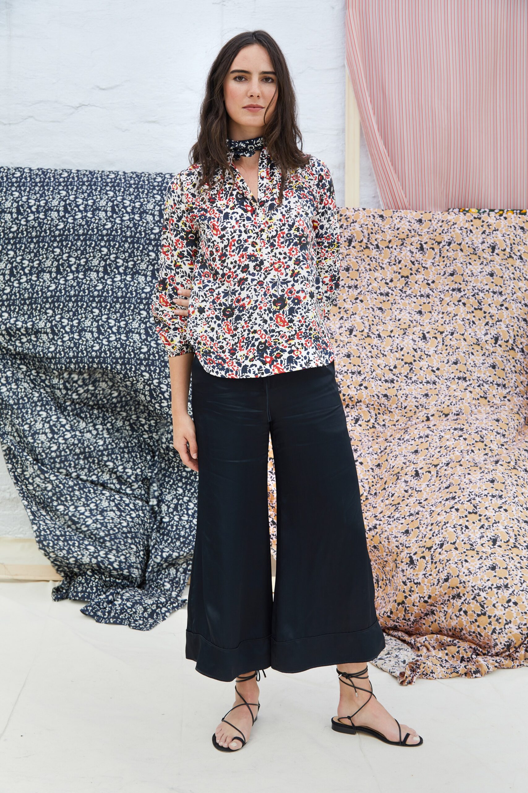 floral blouse and black wide-leg pants