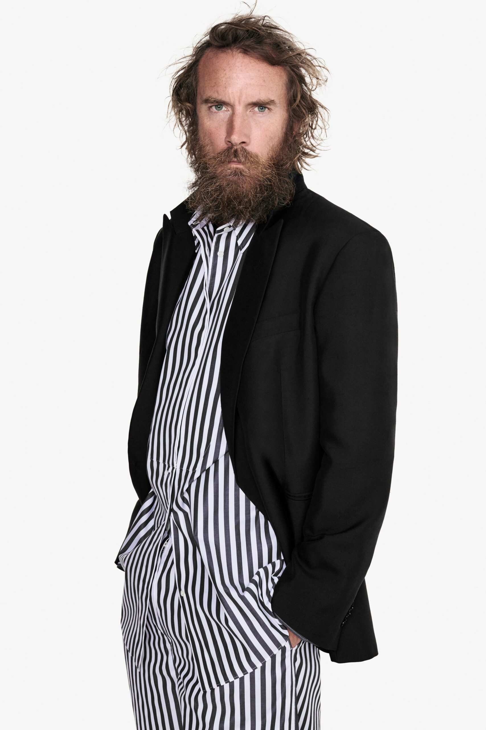 black tailored blazer with striped shirt