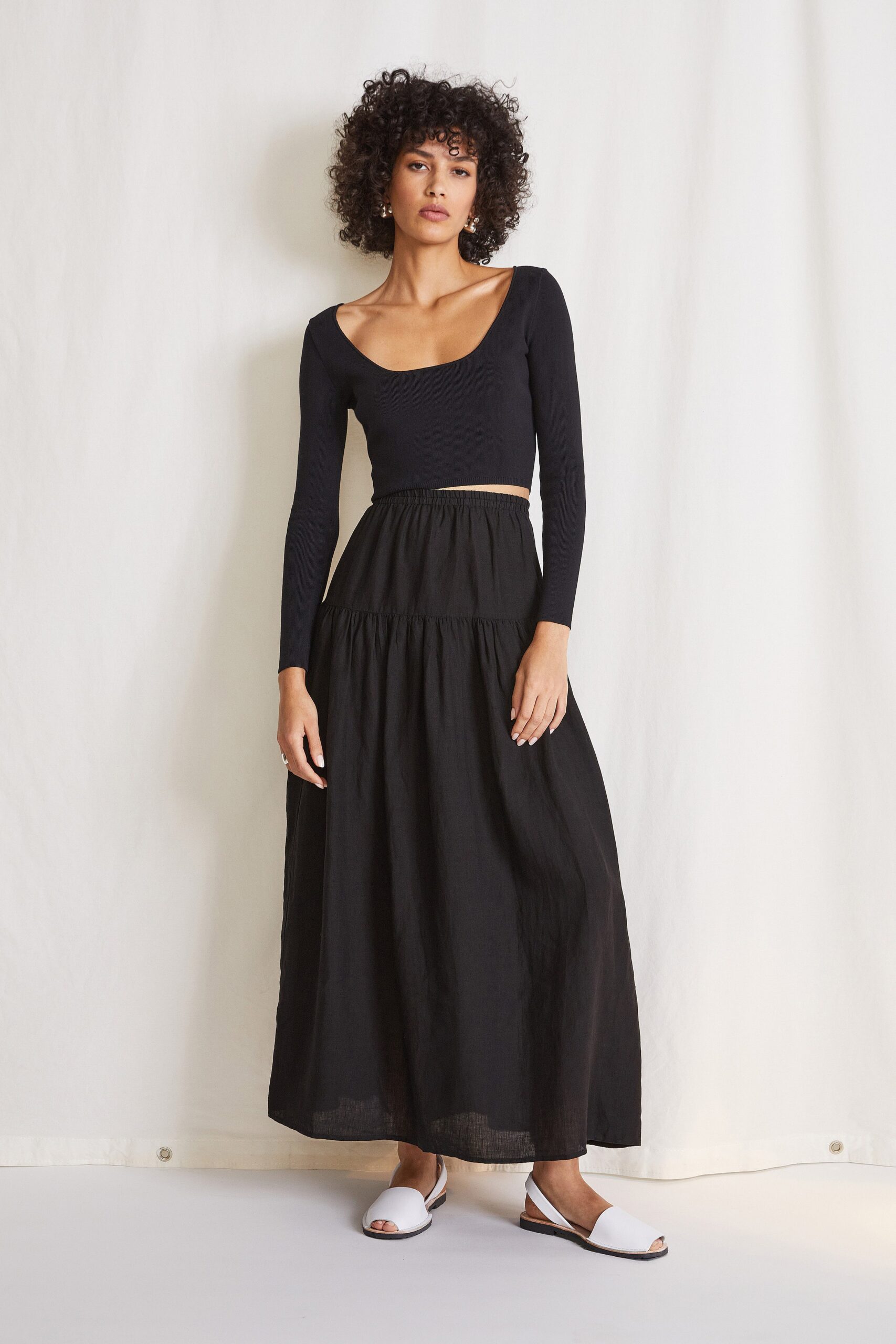 black fitted top and tiered skirt