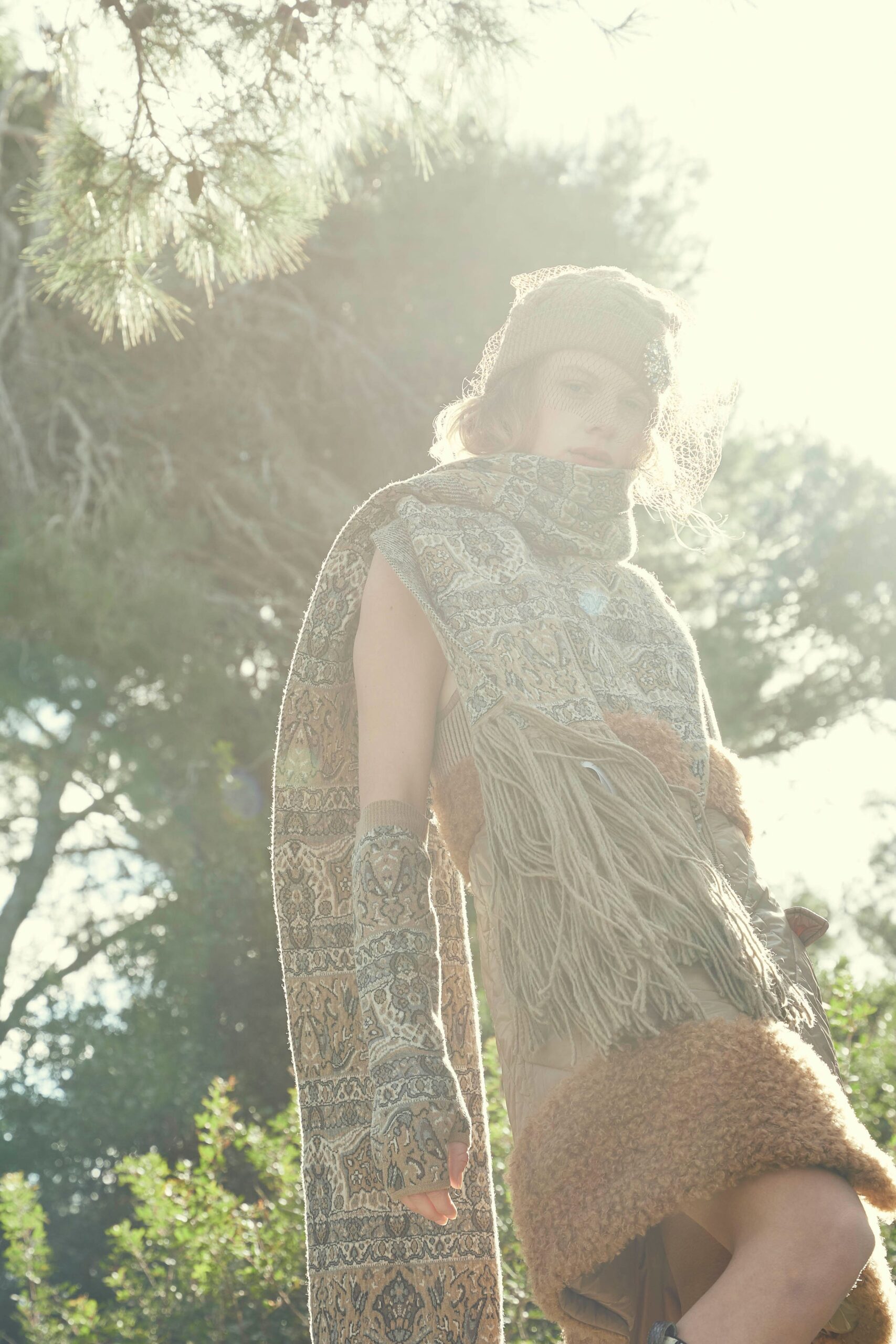 beige embroidered cape and brown dress