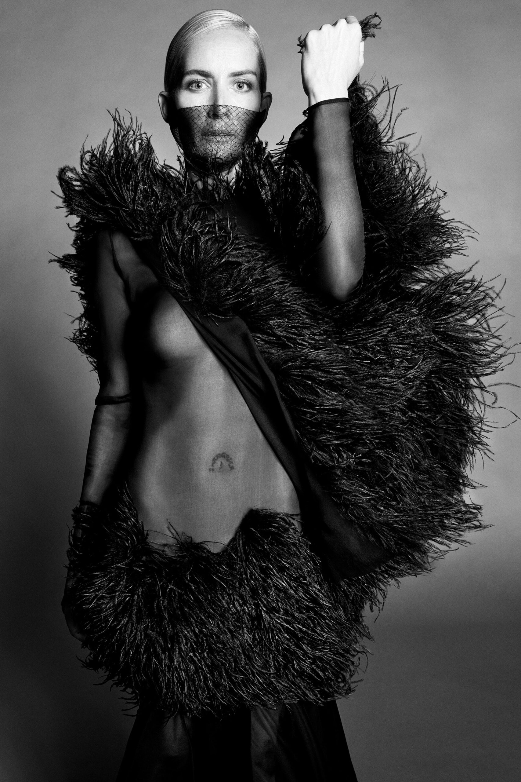 black fringed cape and sheer top