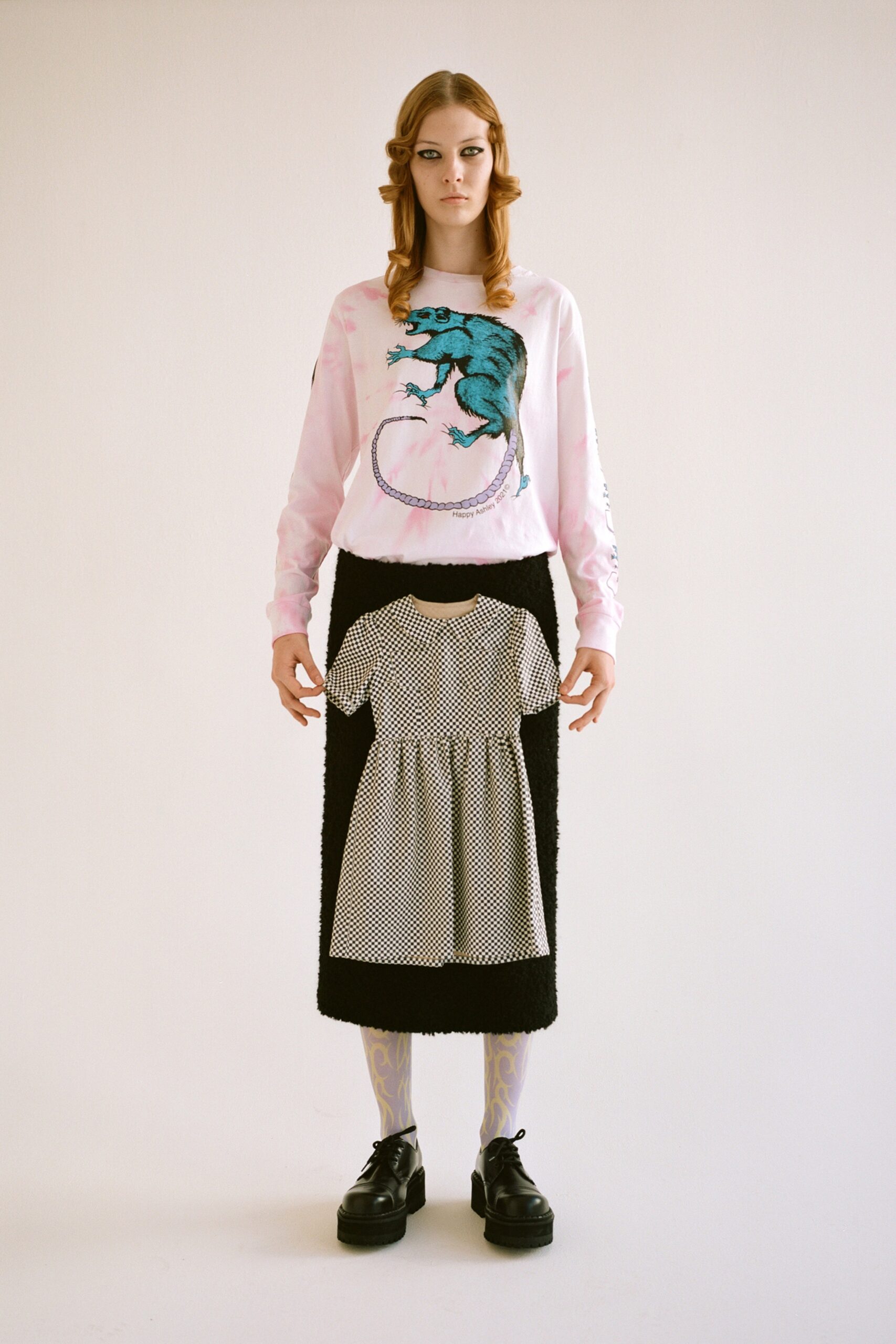 pink printed sweater black skirt