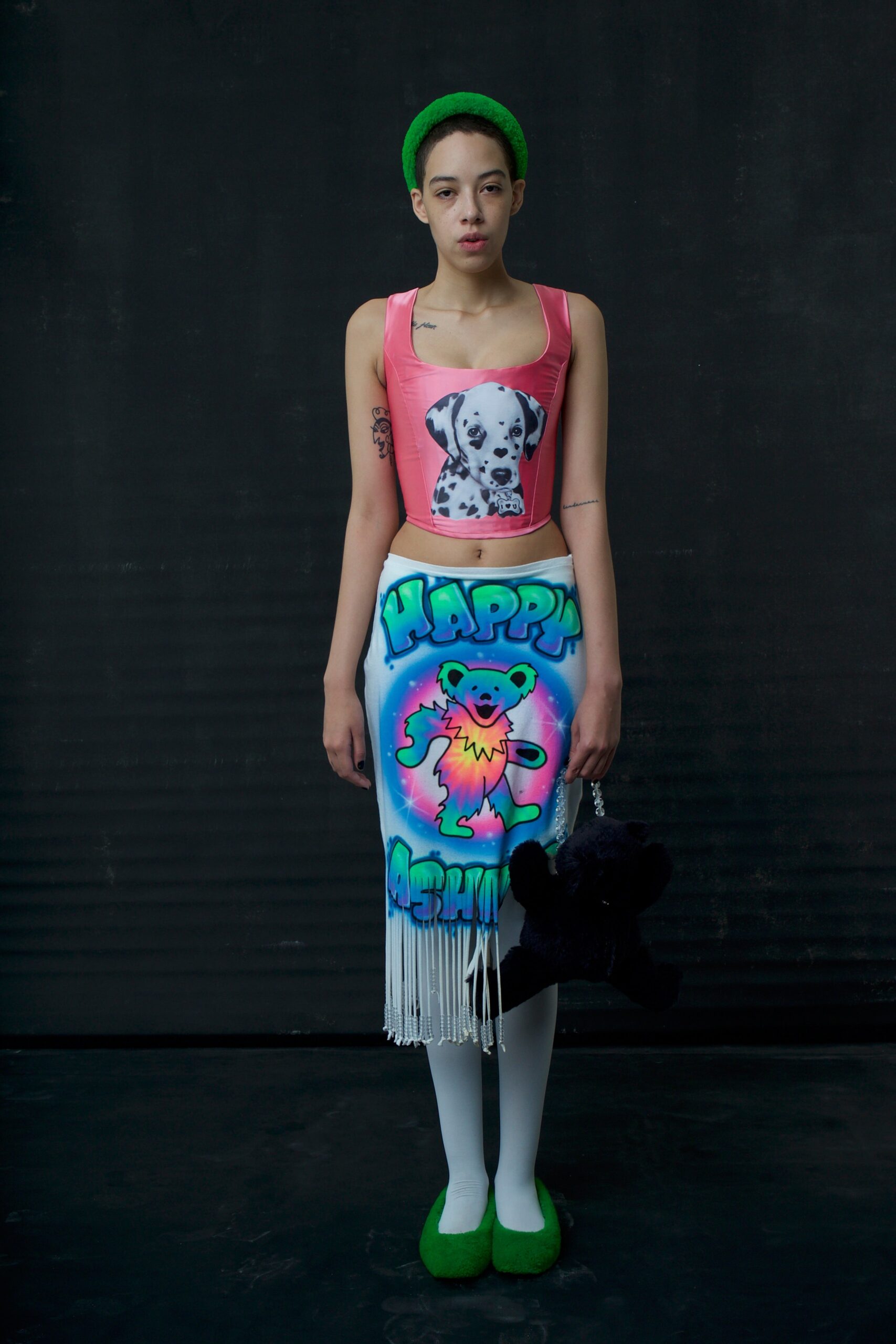 pink printed top and blue fringed skirt