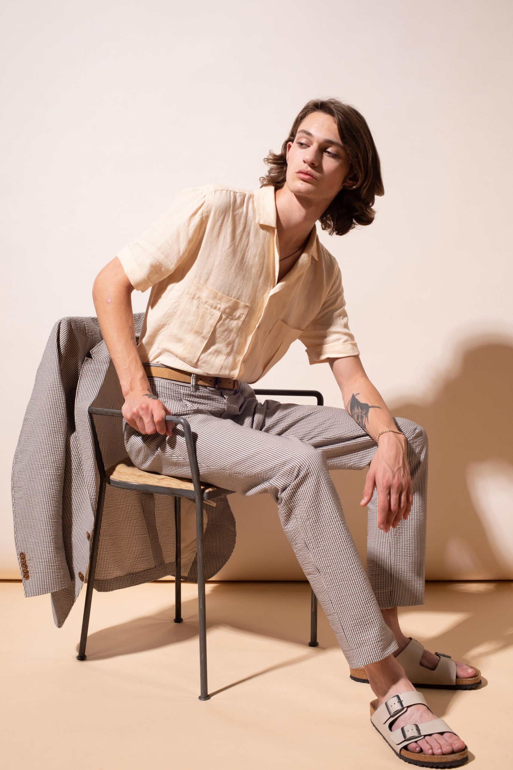 beige relaxed shirt with gray pants