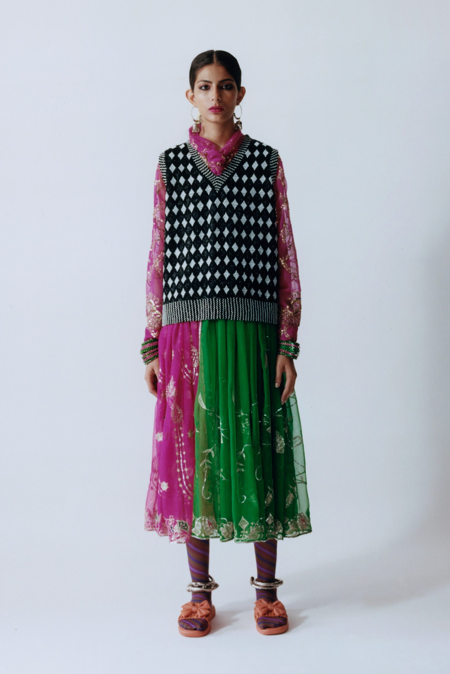 pink chiffon top with black vest