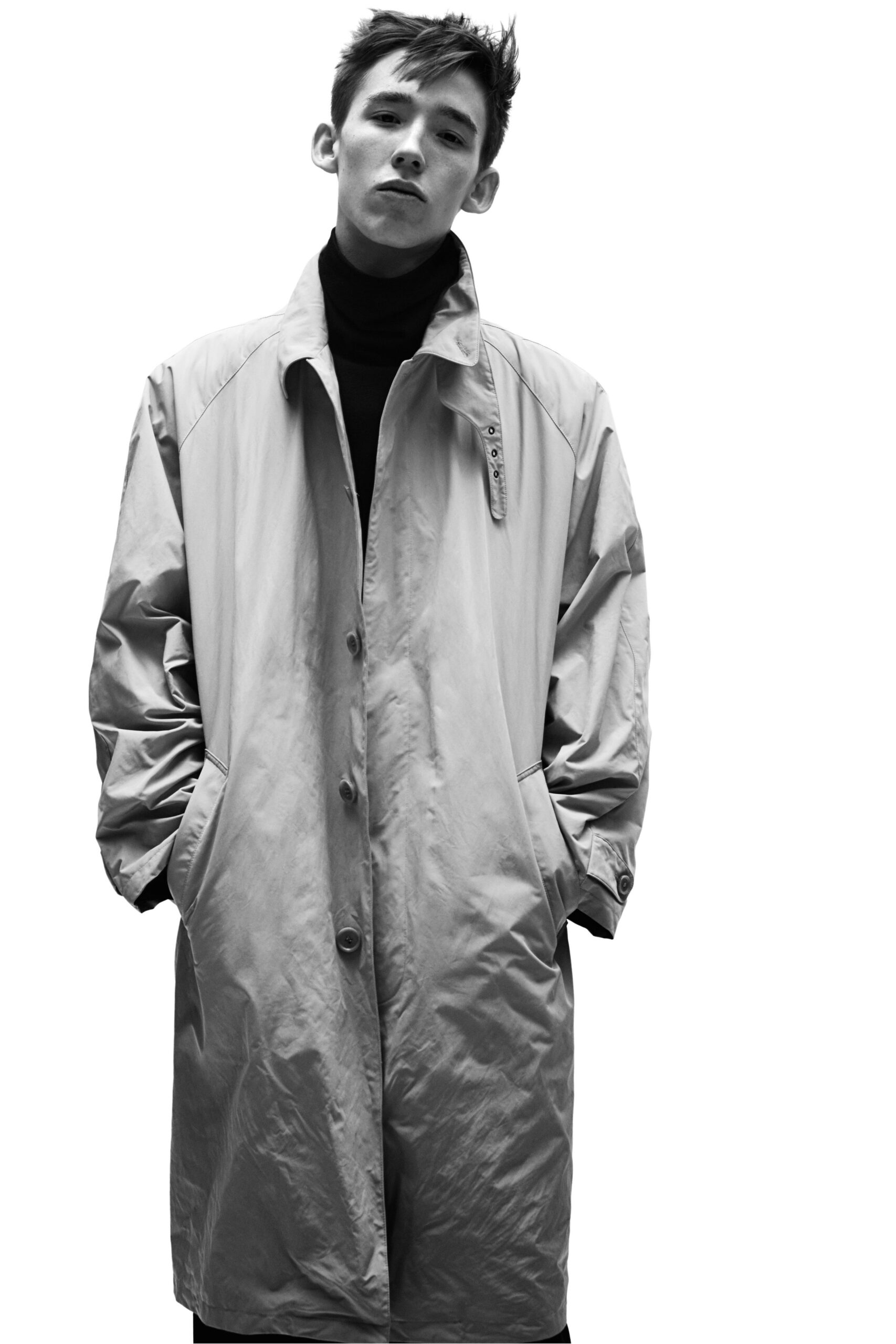 gray vinyl coat and black turtleneck