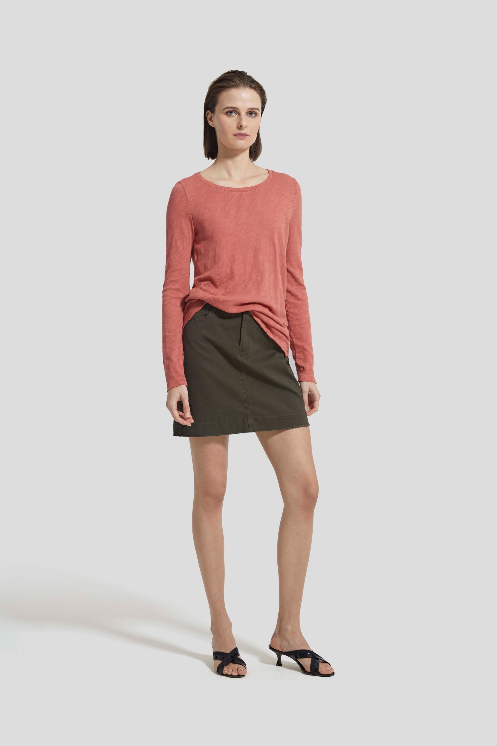 red relaxed top with green skirt