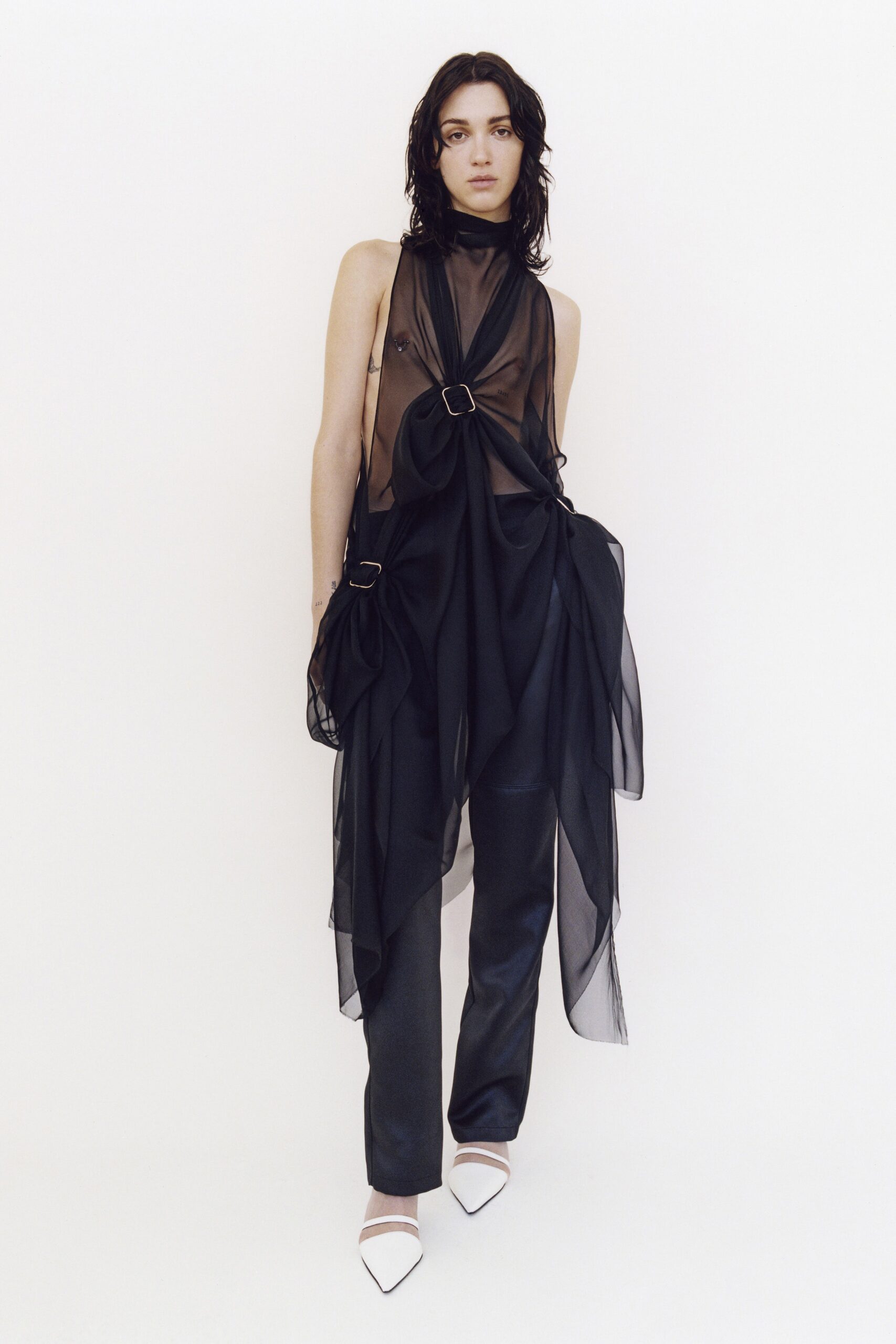 black sheer draped dress with tailored pants