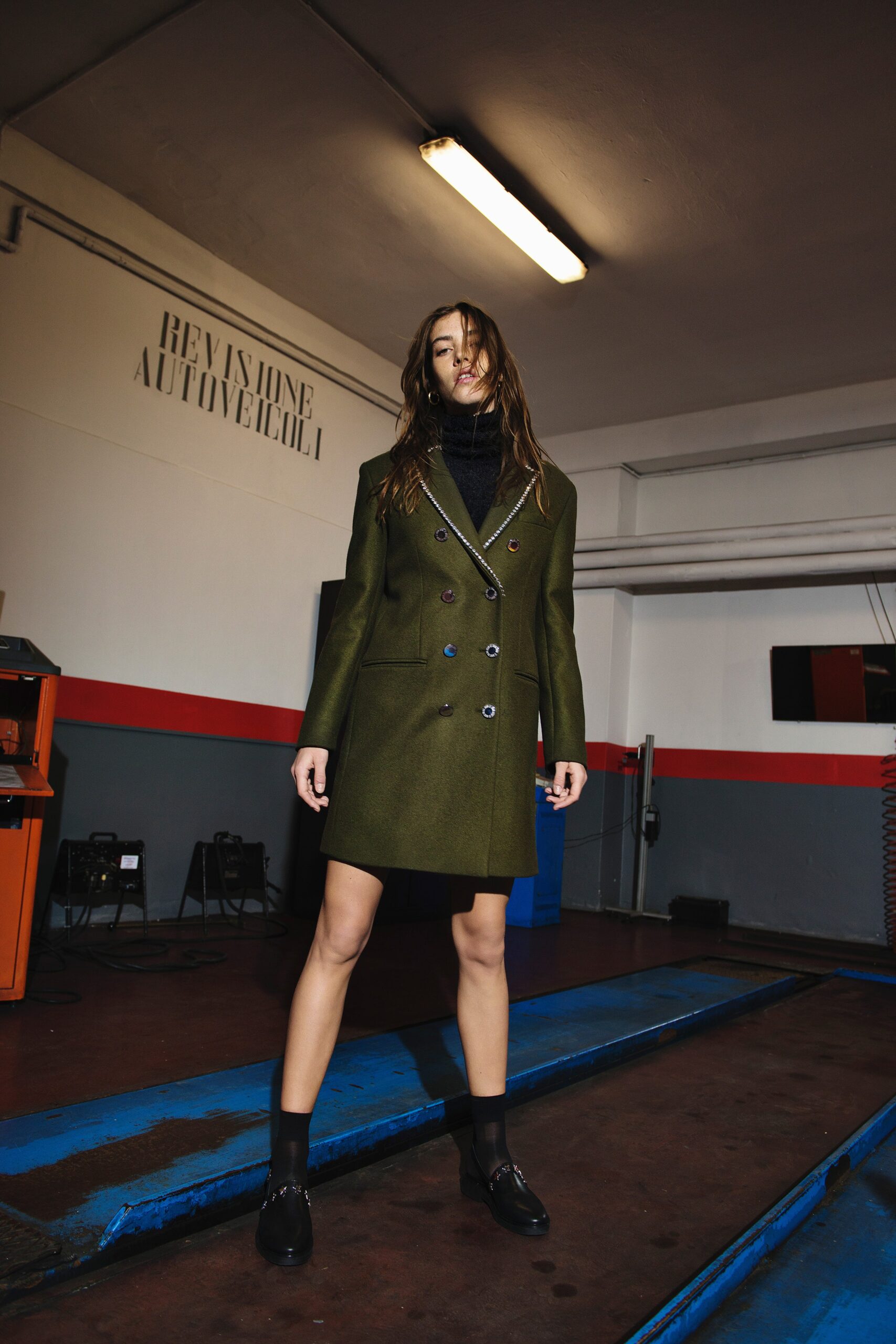fitted green wool coat and black dress