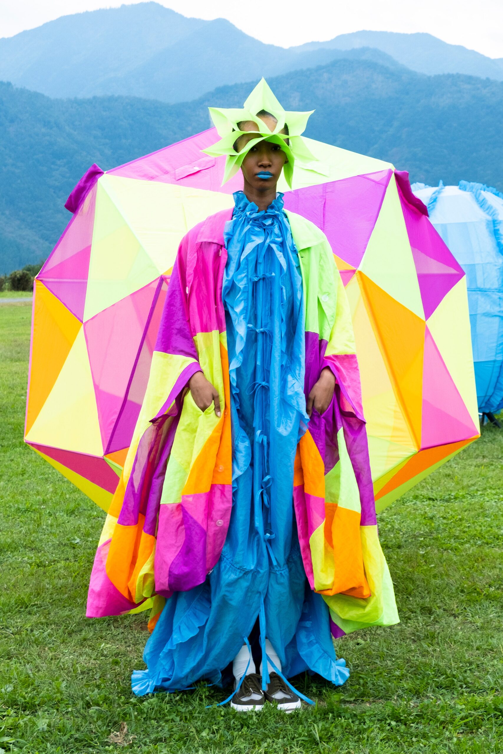 colorful flowing dress and cape