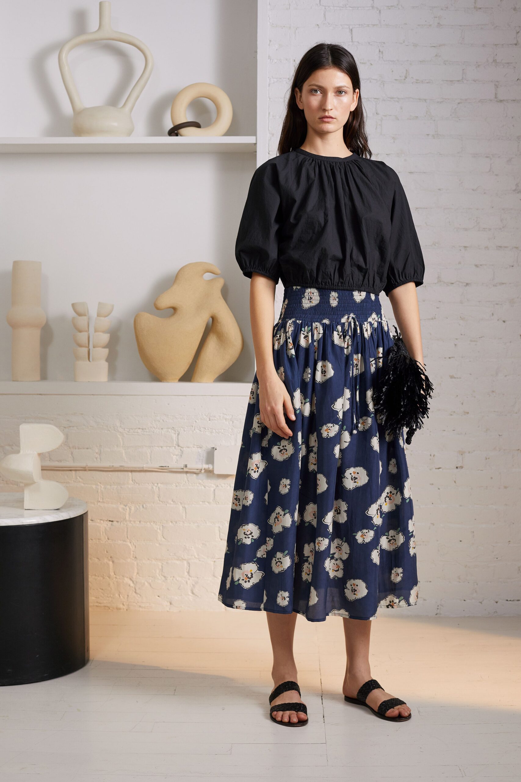 black top and blue printed skirt