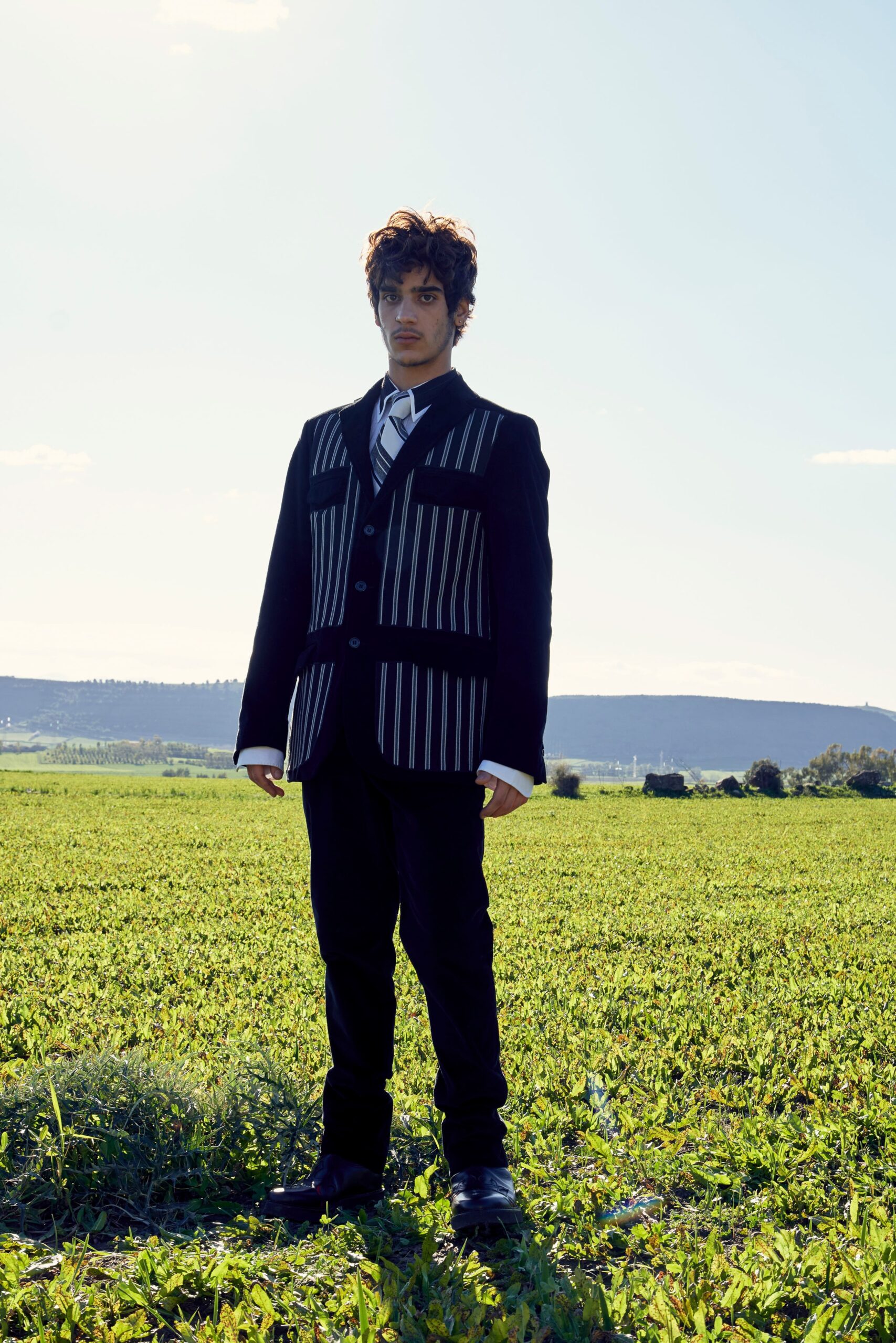 black and white striped blazer with slim pants