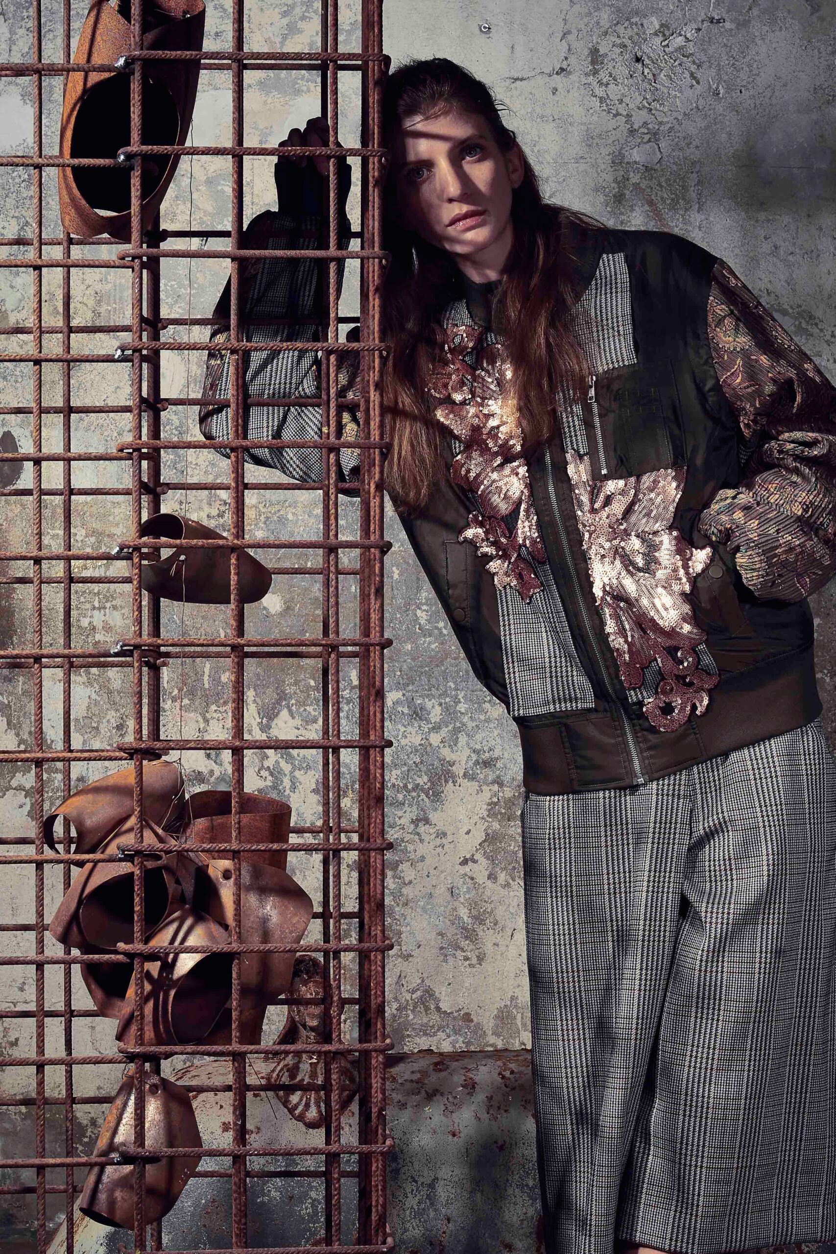 embroidered green jacket and gray shorts