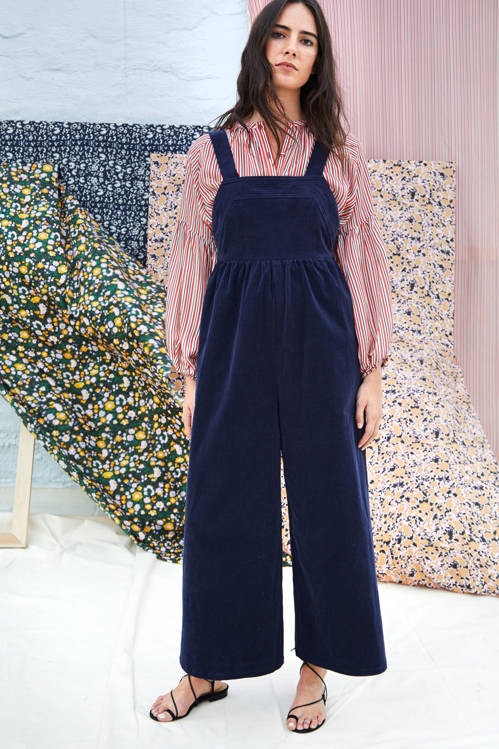 striped shirt and blue jumpsuit